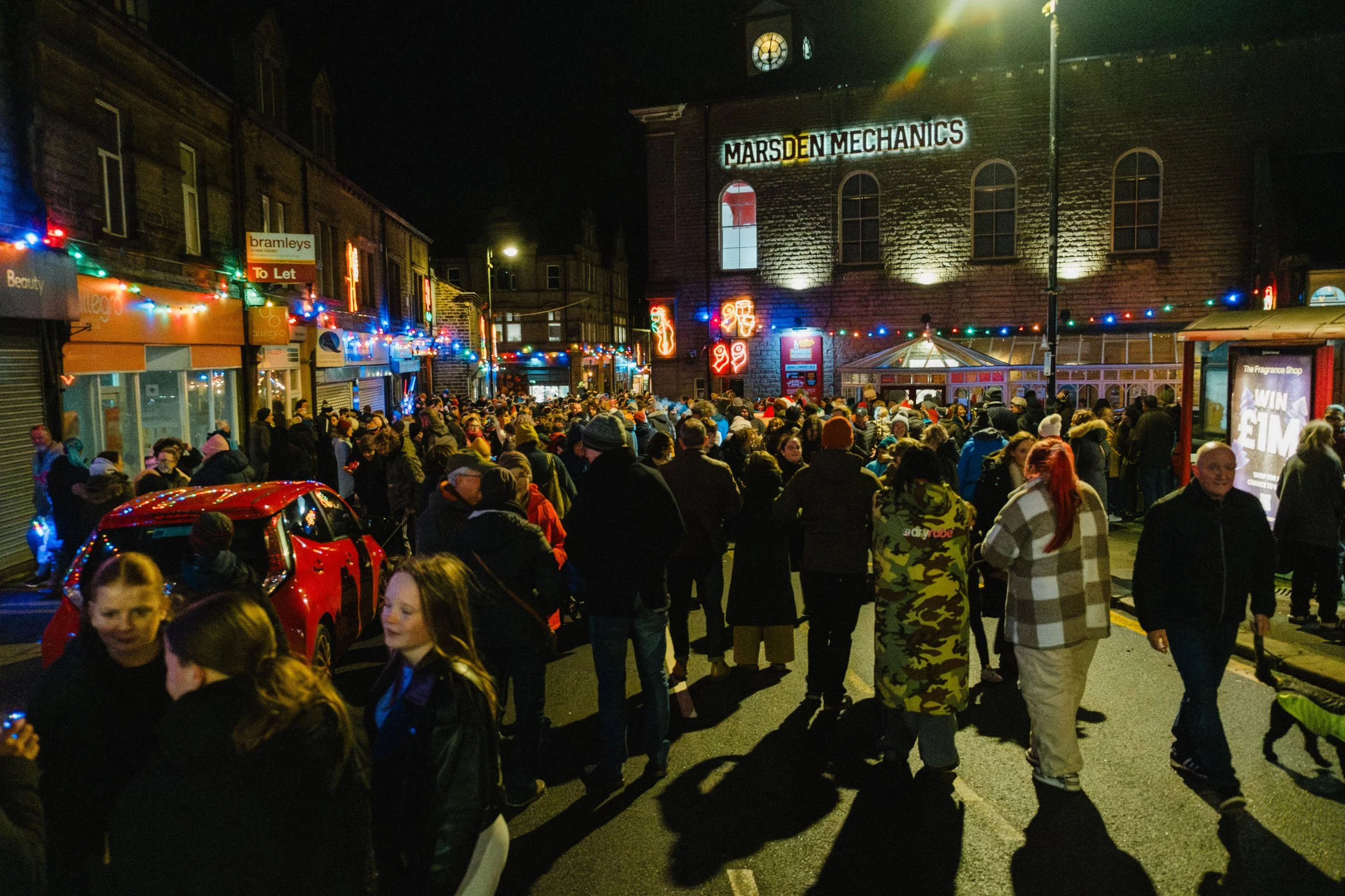 Crowds gathering for the Christmas Lights switch-on in Marsden, West Yorkshire.