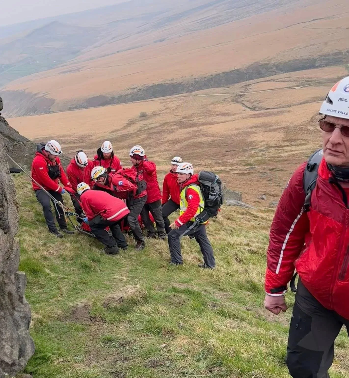 Members of the Holme Valley Mountain Rescue Team in action.