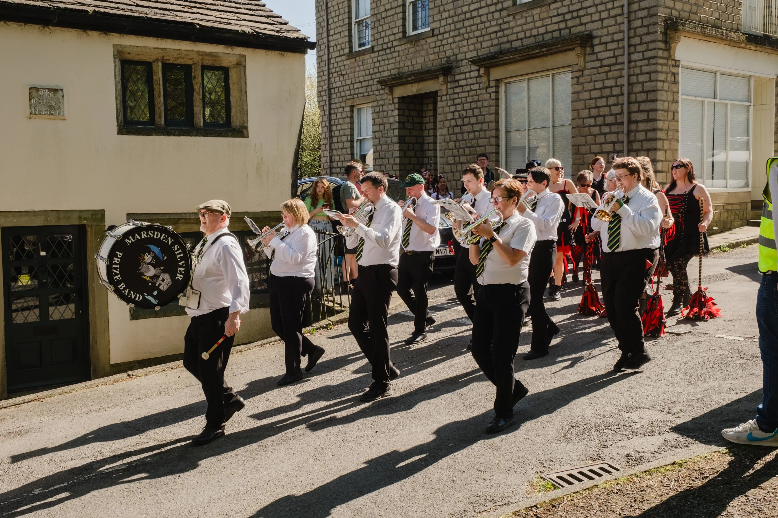Marsden Silver Prize Band marching during Cuckoo Day in Marsden, West Yorkshire.