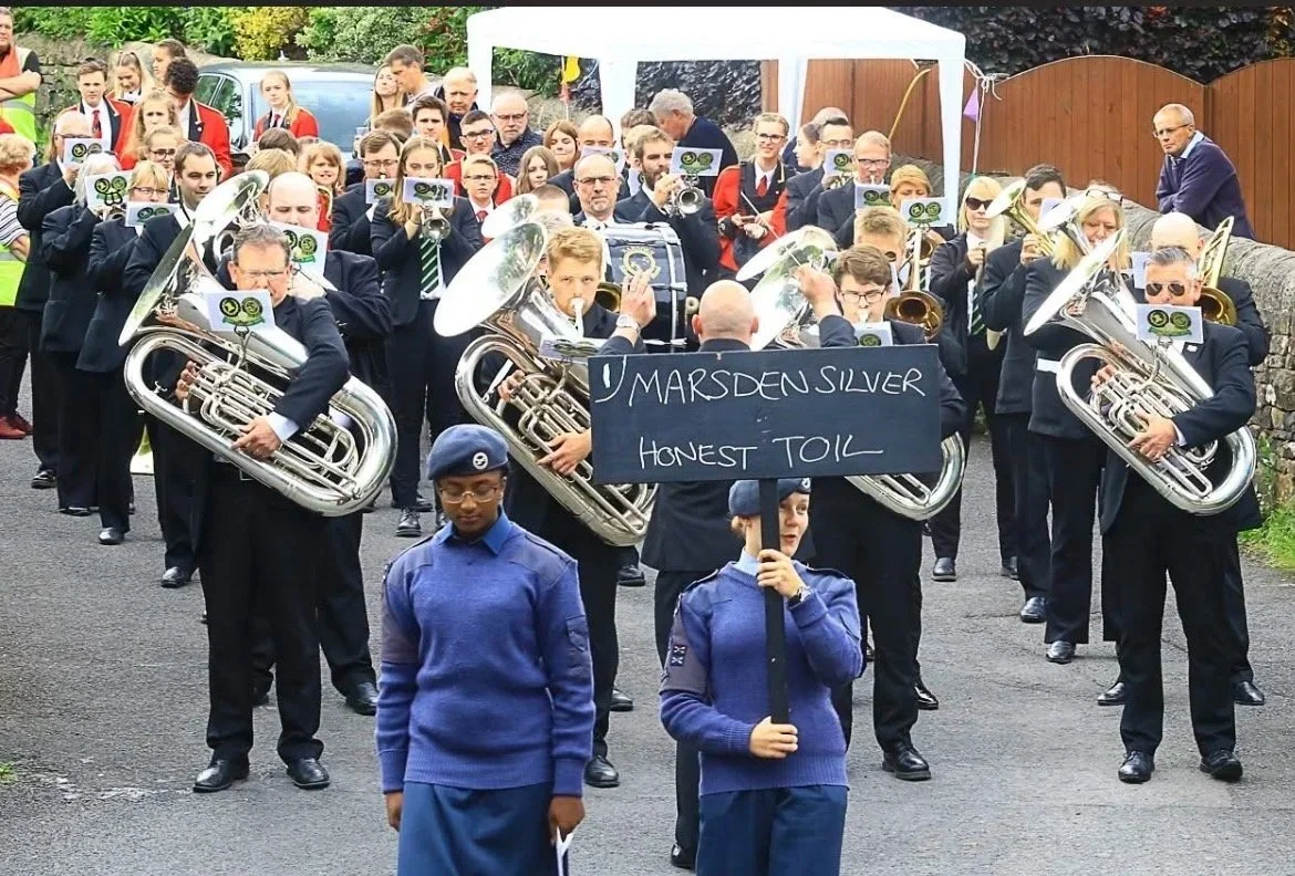 Marsden Silver Prize Brass Band playing and marching in a band competition.