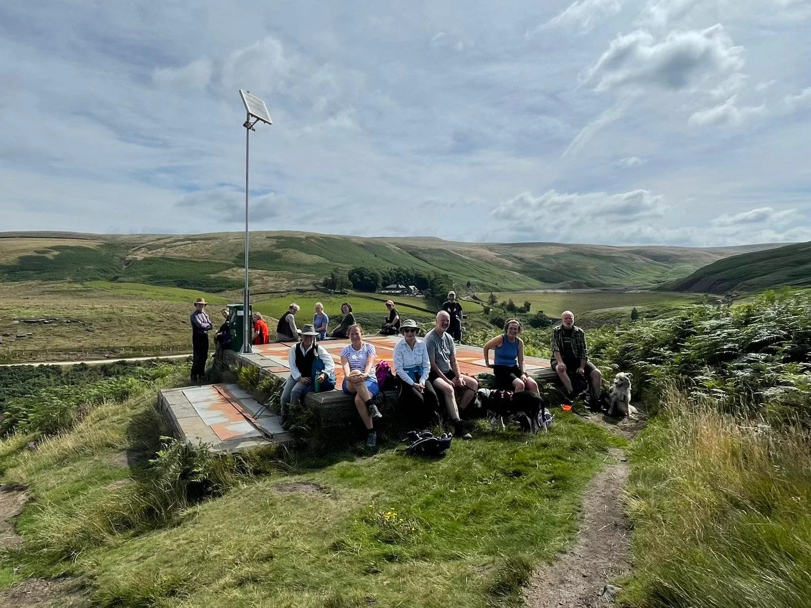 Members of the West Yorkshire-based Marsden Walkers Are Welcome group having a rest mid-walk.