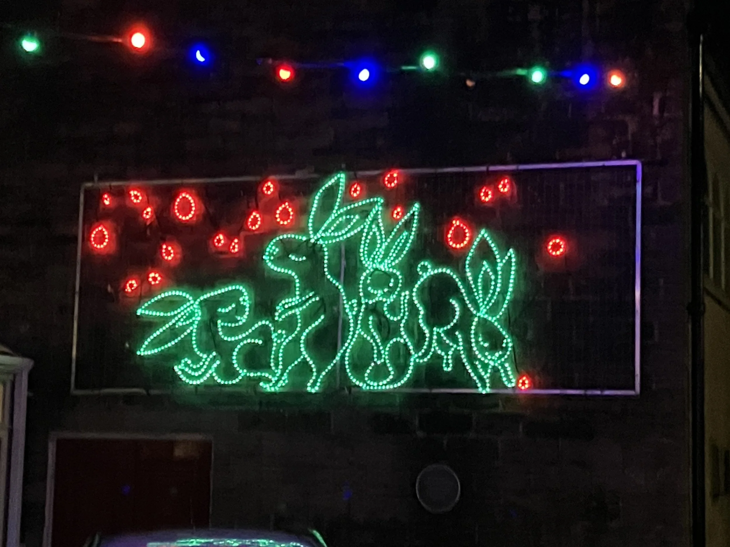 An arrangement of green rabbits in Marsden's Christmas lights, West Yorkshire.