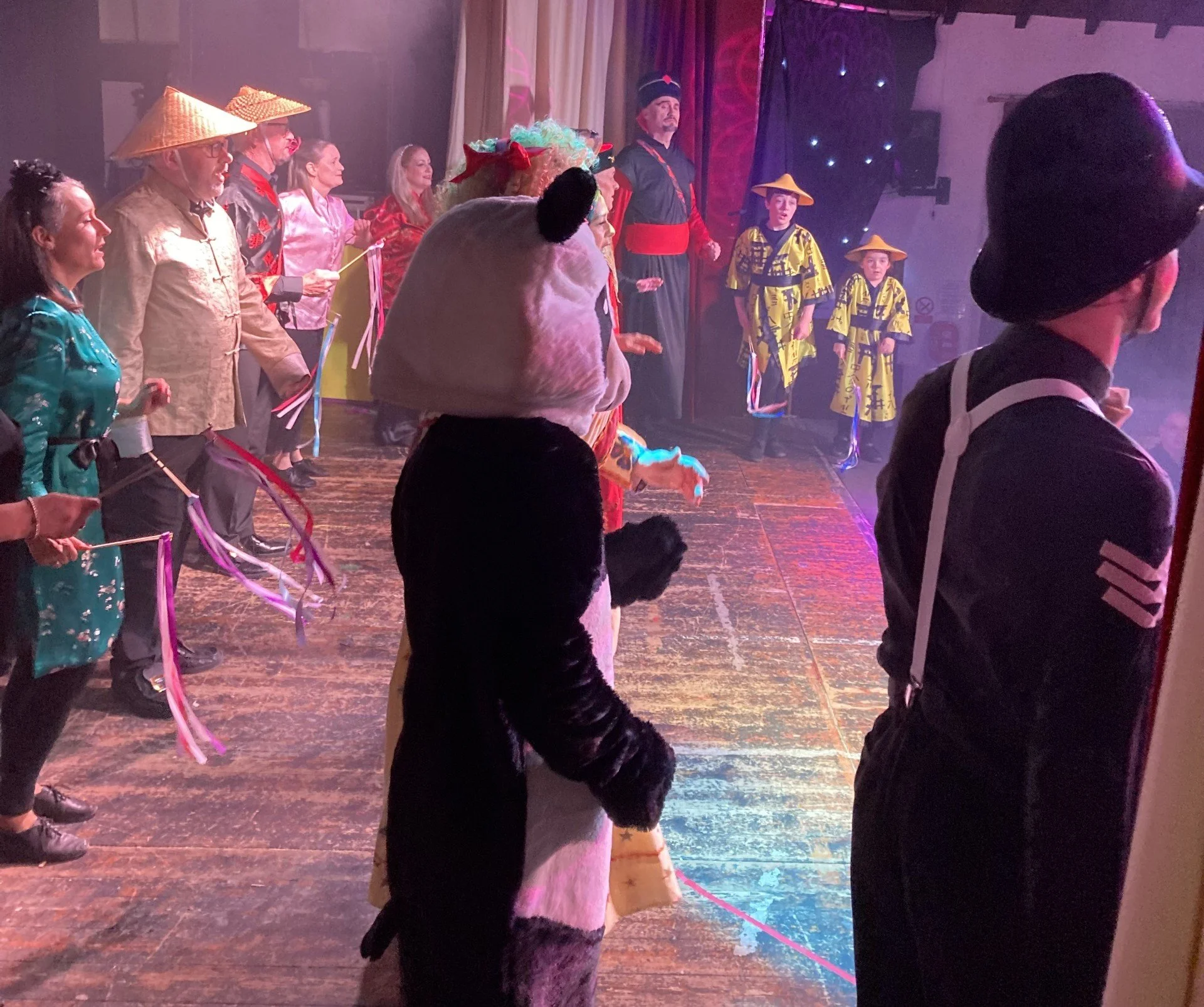 Actors on stage during a production by the Marsden Operatic and Dramatic Society in West Yorkshire.
