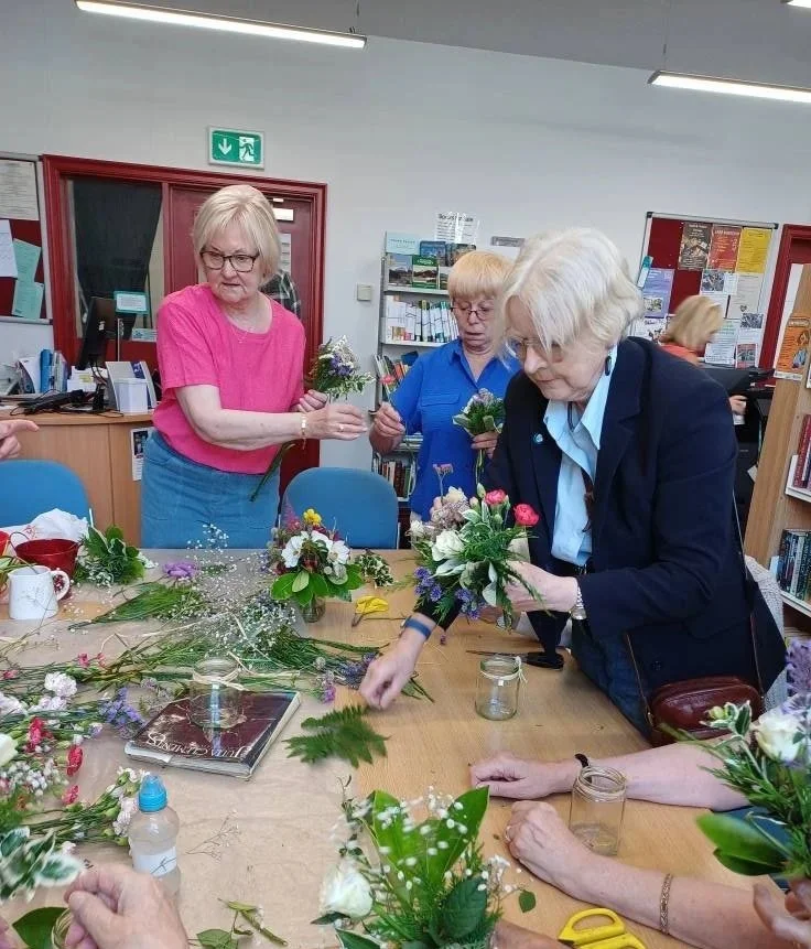 A flower arranging class held by the Marsden Cuckoo'S WI in Marsden, West Yorkshire.