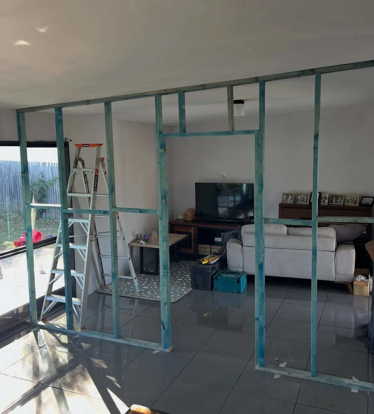 Over x-mas I built a non-load bearing wall + fixed plasterboard for a friend who wanted to add another bedroom to his house. A little bit of challenge because we had doors/windows on either side. But at the end it came up nice with a bit of custom fr