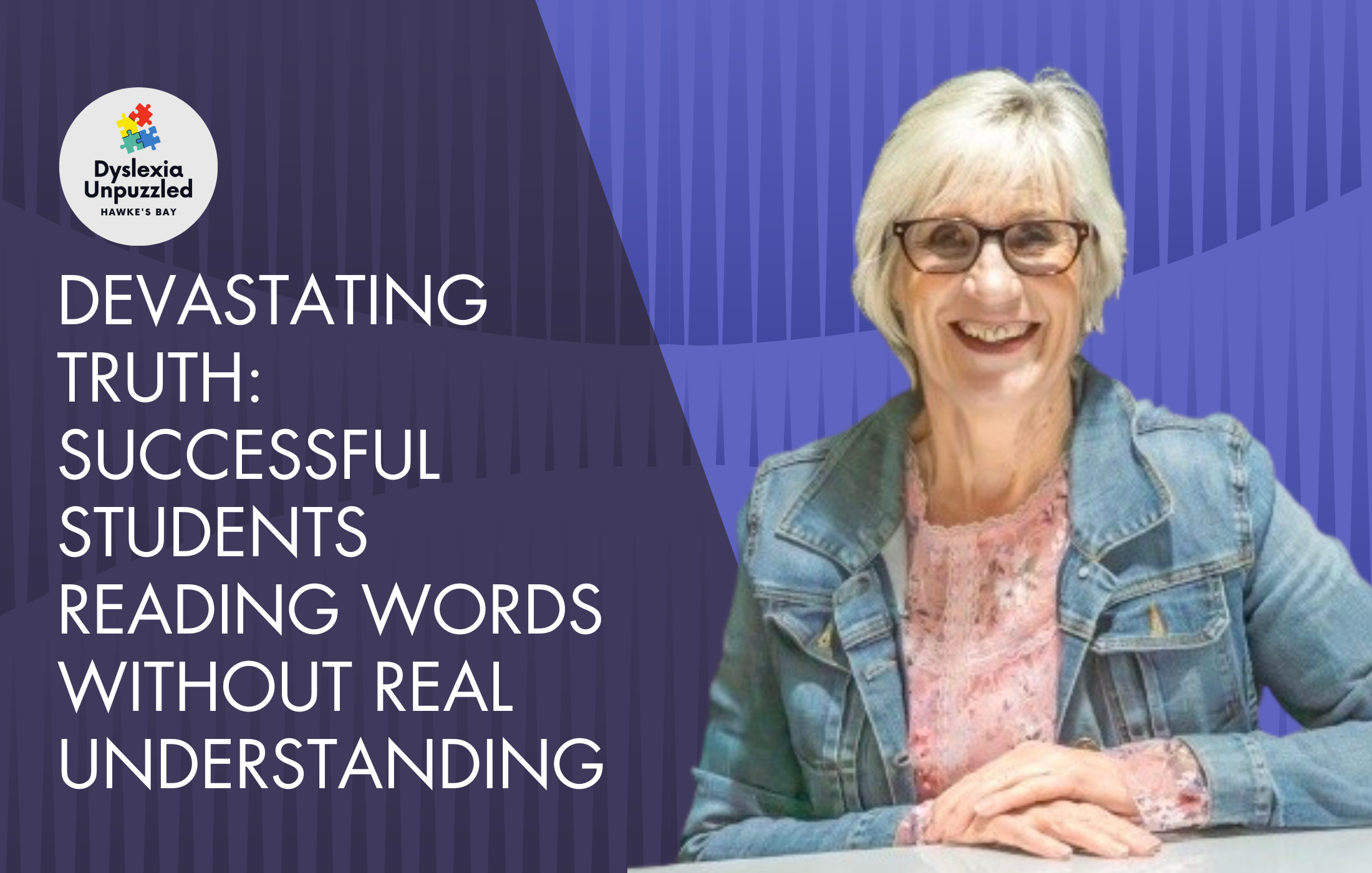A smiling elderly woman with short gray hair and glasses, wearing a denim jacket and floral blouse, sitting at a table with her hands folded.
