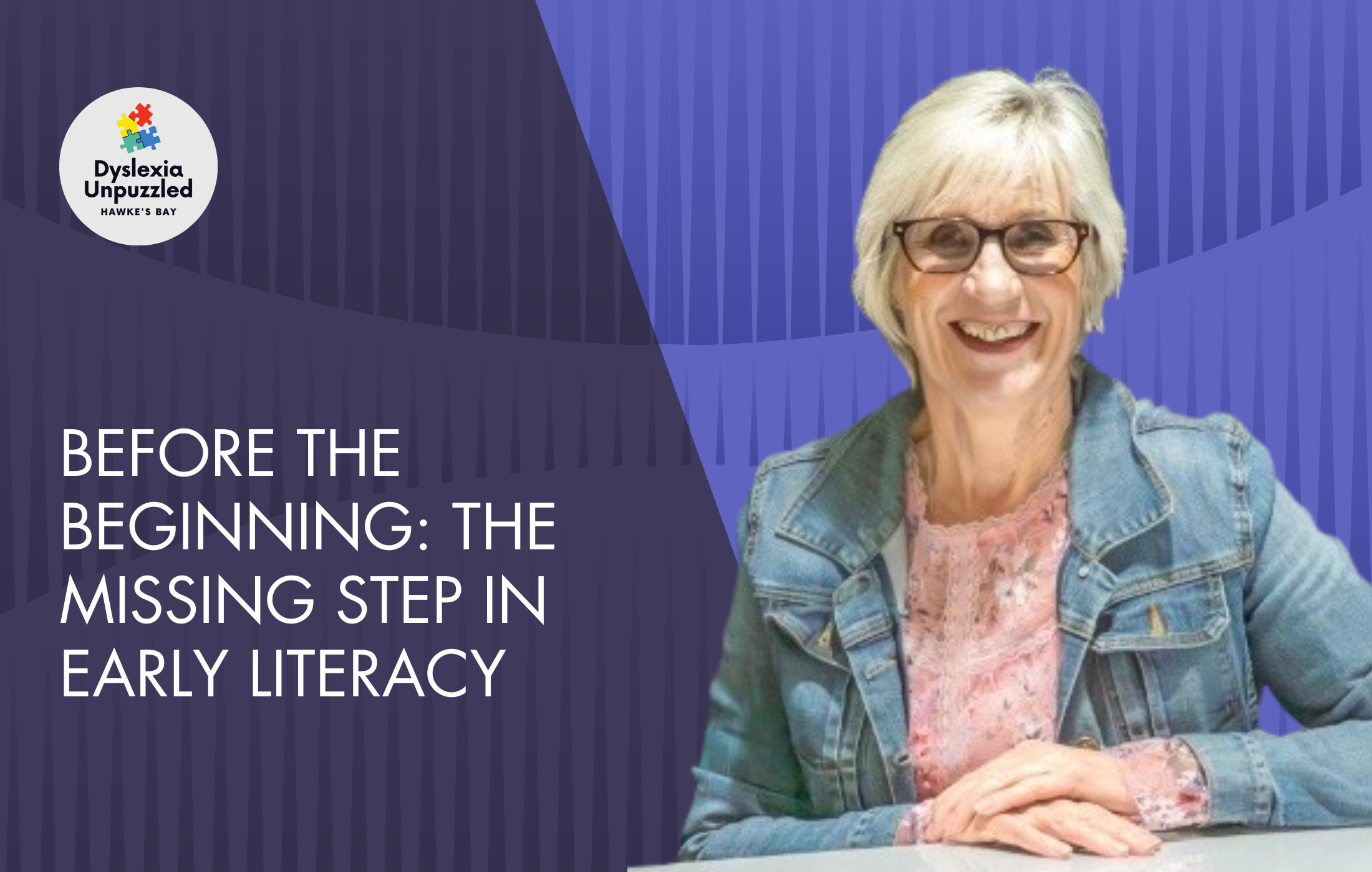 A woman with short gray hair and glasses smiling, wearing a pink blouse and denim jacket, sitting at a table. There is a logo of Dyslexia Unpuzzled Hawke's Bay and a book title that reads, "Before the Beginning: The Missing Step in Early Literacy" in the background.