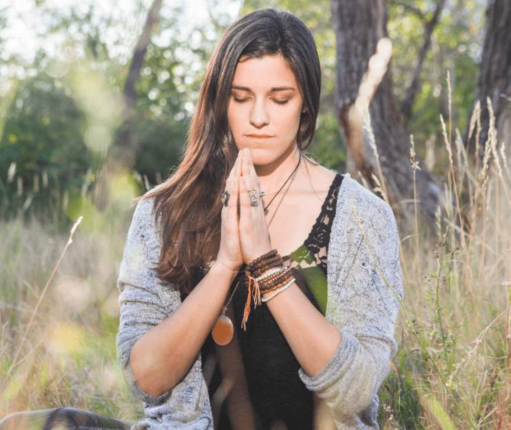 Woman praying outside