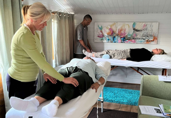 Course participants channeling Usui healing energy during a Reiki Level 2 training class in Clacton