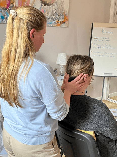 Students learning sitting down healing with Kotodama on a Reiki 2 course serving Clacton and Colchester.
