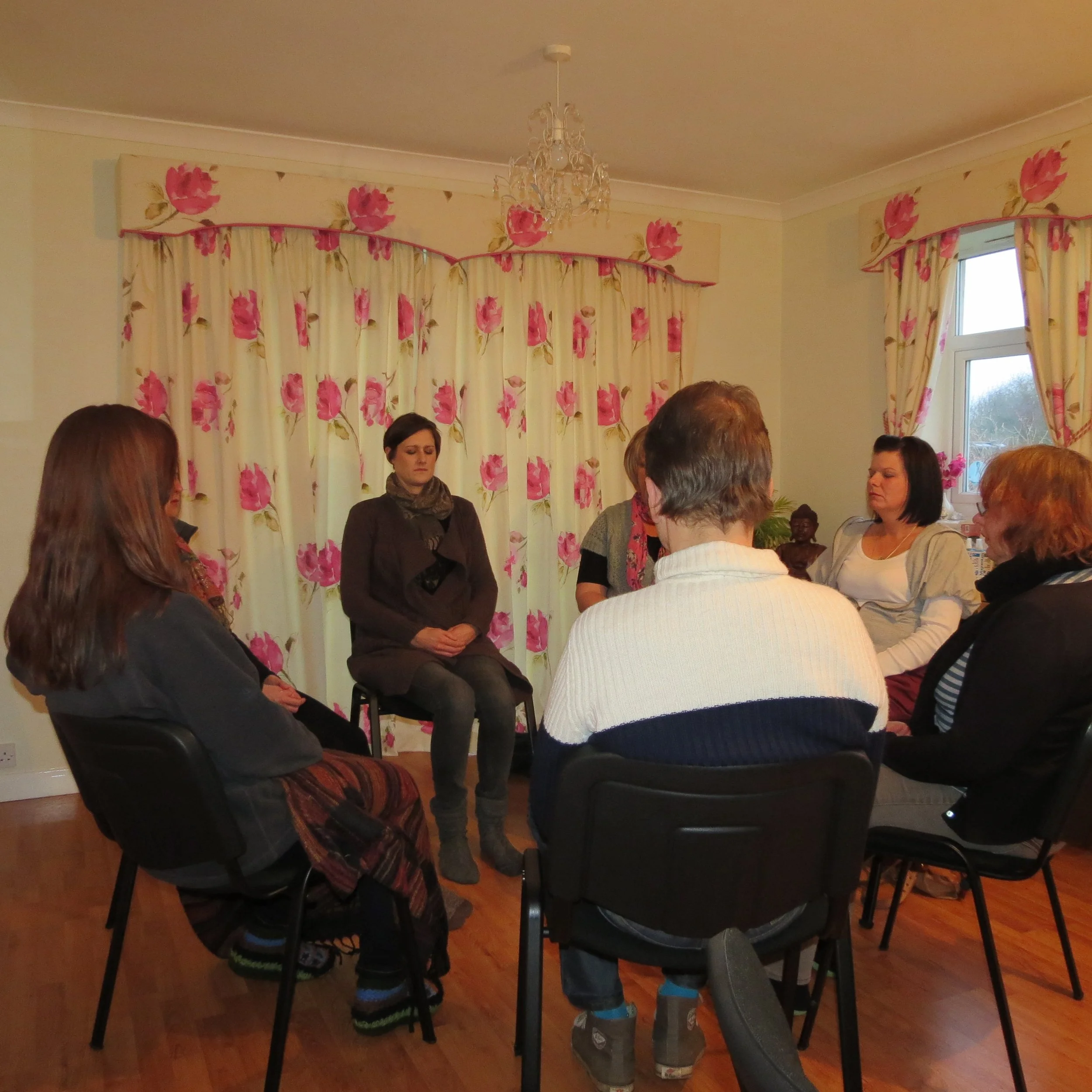 Group of people meditating with Katarina Tilley