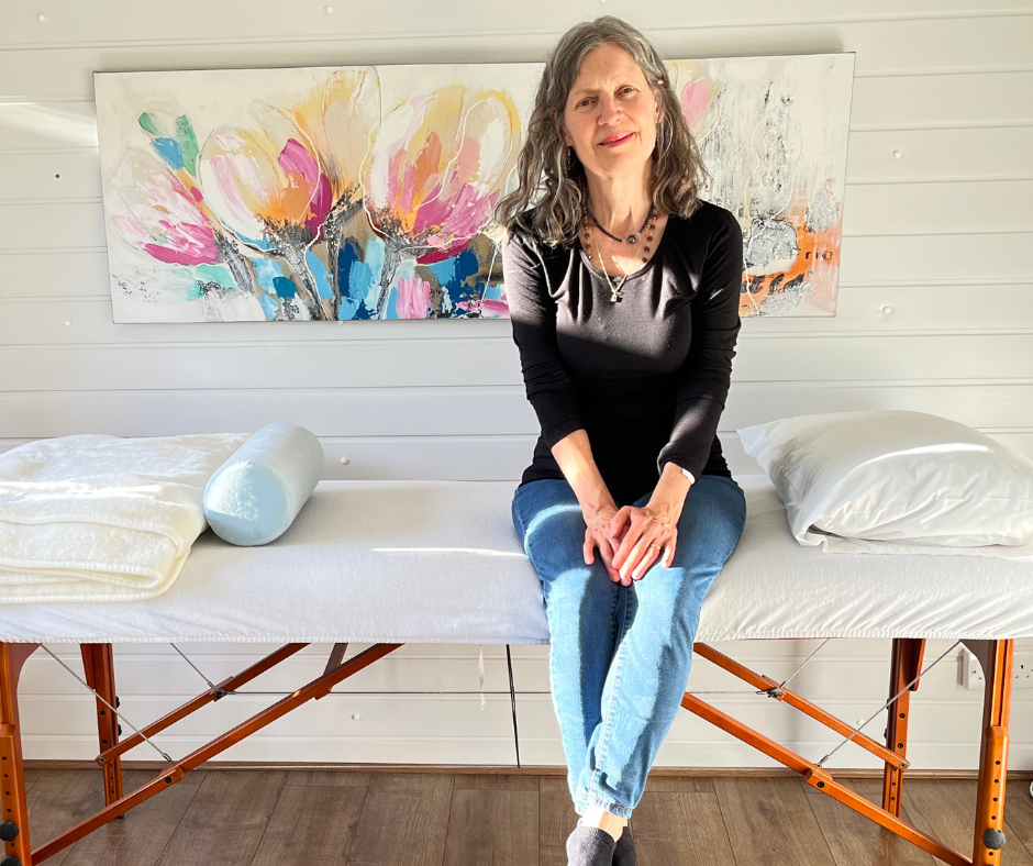Meditation teacher Katarina Tilley (Saguna) in a calm garden sanctuary in Point Clear, offering mindfulness training for Clacton & Colchester residents.