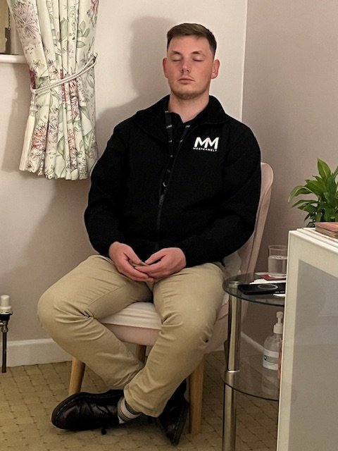 Young man sitting meditating