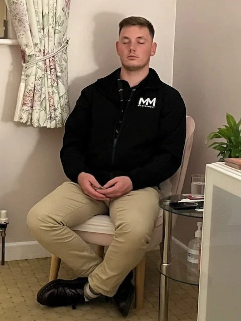 A young man sitting comfortably in quiet meditation during mindfulness meditation course serving Clacton and Colchester.