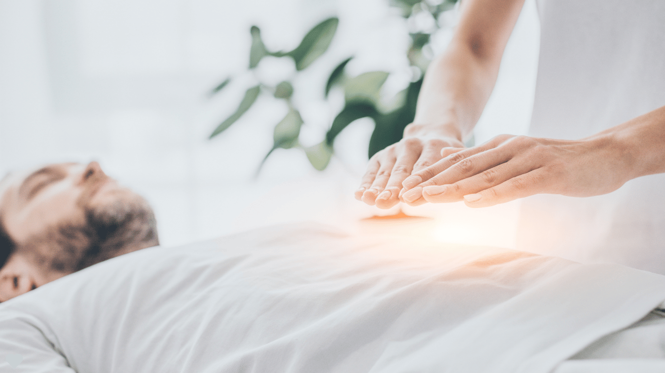 A serene man receiving a Reiki healing treatment, serving as the main header banner for the Reiki healing and courses page at the Katarina Tilley Meditation Centre in Clacton-on-Sea, Essex.