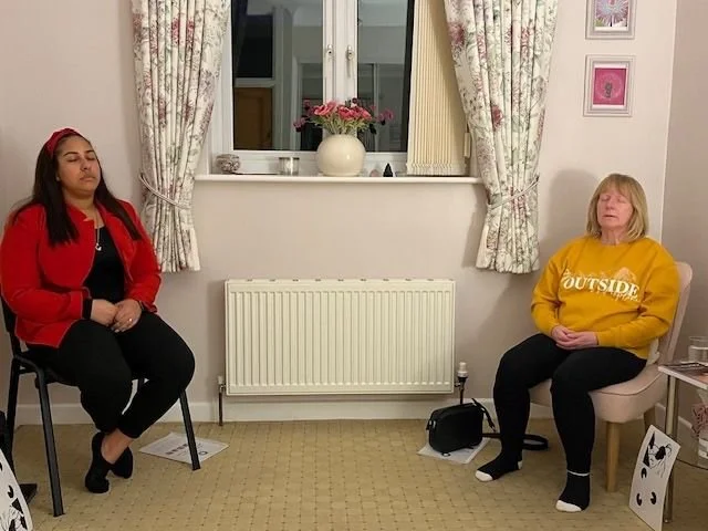 Two students practicing mindfulness meditation during a course serving the Colchester and Clacton areas.