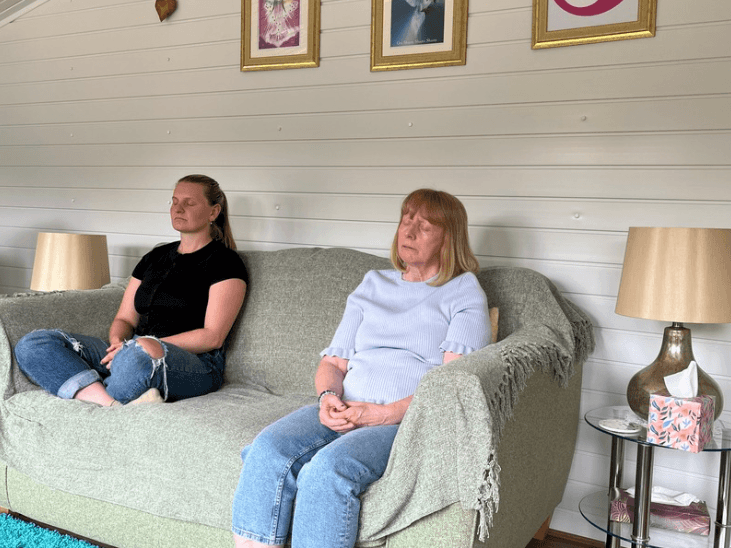Two women practicing mindfulness meditation together during a session for the structured Mindfulness Meditation Course by Katarina Tilley in Clacton-on-Sea, Essex.