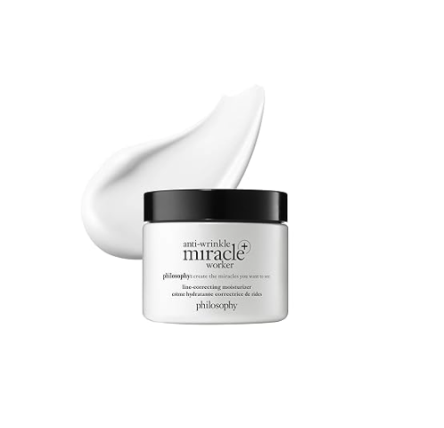 A jar of Philosophy Miracle Worker anti-wrinkle moisturizer with a dollop of cream and a smear of the product surrounding it.