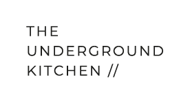 Logo with text 'The Underground Kitchen' in black on a white background.