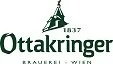 Ottakringer beer logo with a green text and a small depiction of a turreted tower with a flag on top