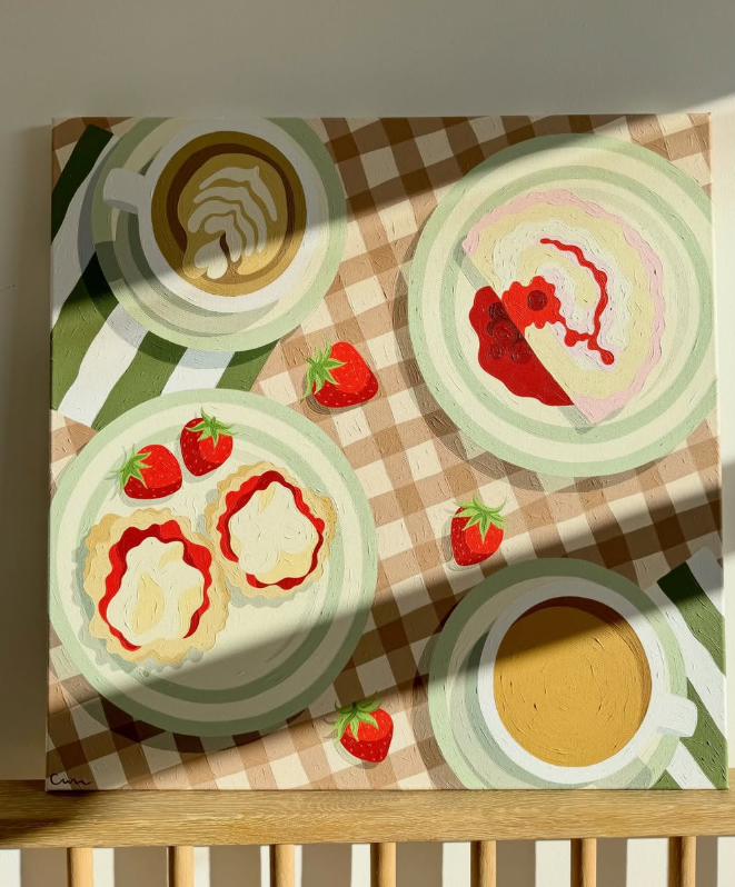 Painting of a café scene with coffee, tea, cake and scones on a checked tablecloth.