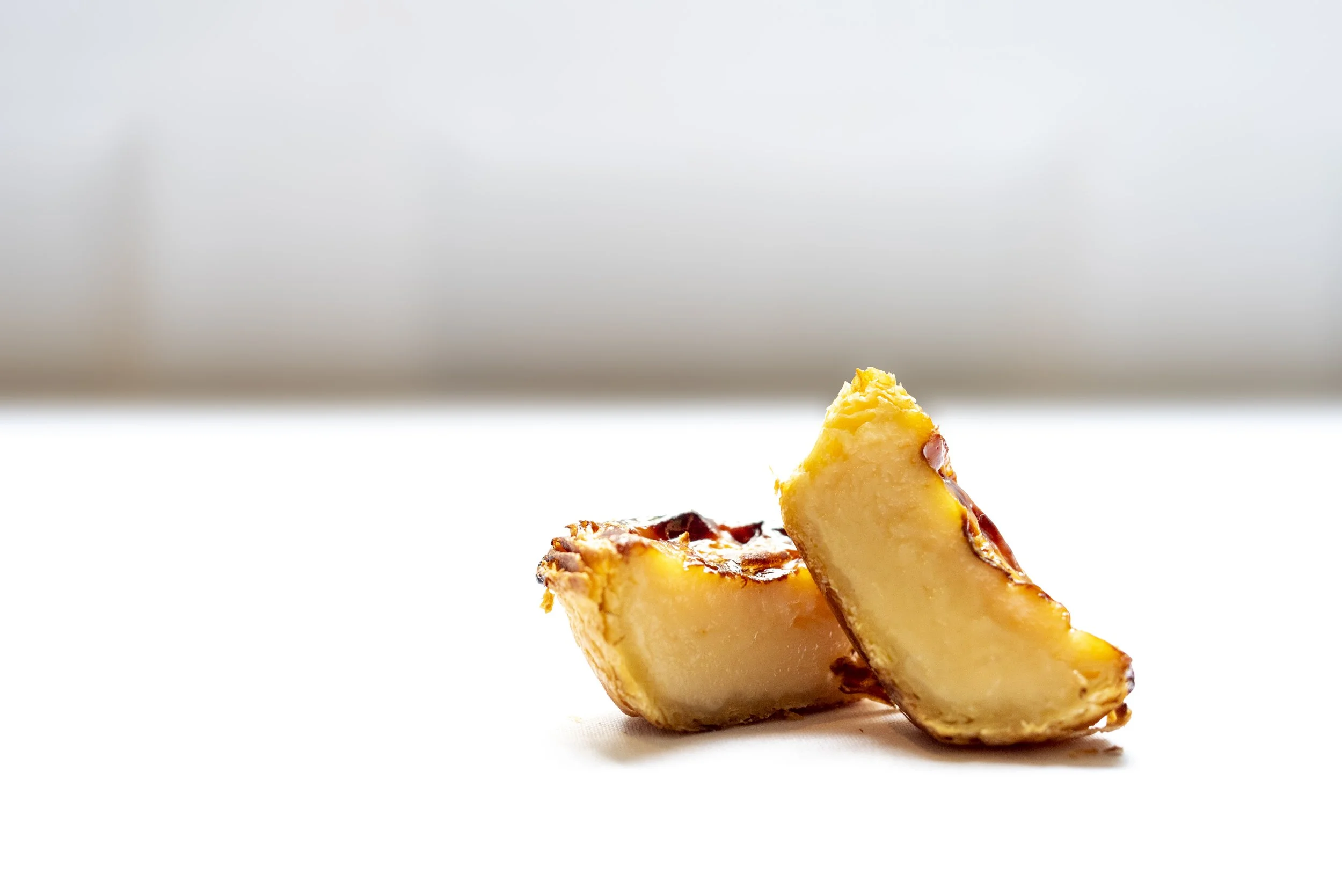 Close-up of a pineapple chunk on a white background.