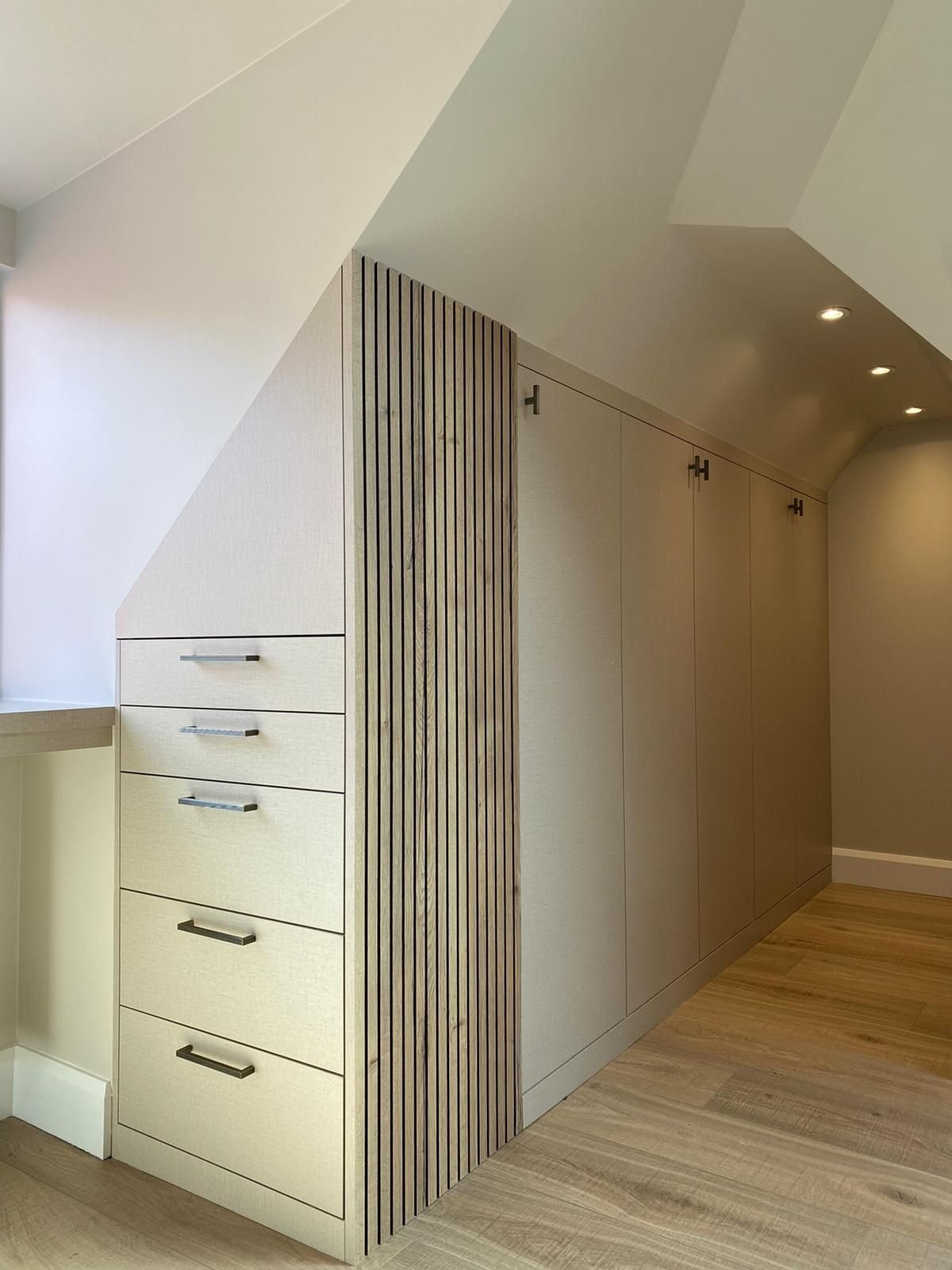 Bespoke built-in wardrobe with fluted panel detail, made by RELM