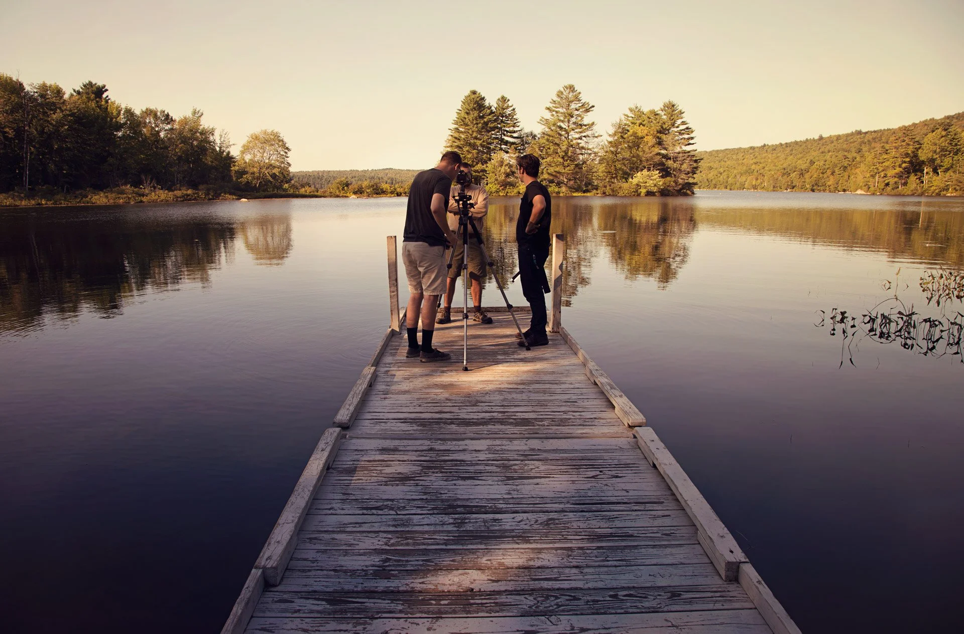 guys-standing-on-dock-filming-on-a-lake-maine-parisleaf.jpg