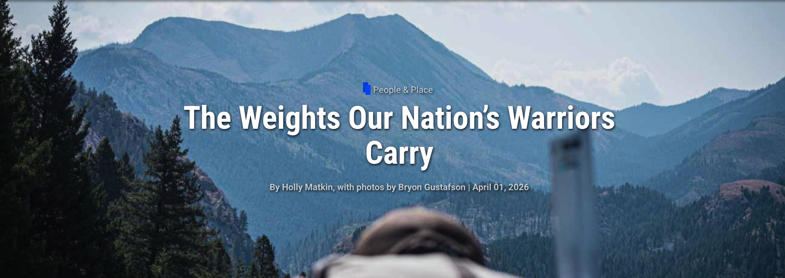 article banner for an article in distinctly montana. looking into a mountain range from over the top of a veteran hiker.
