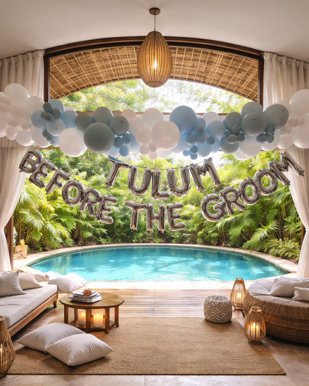 Decorative poolside party setup with balloons, banners, and cushions for a celebration.