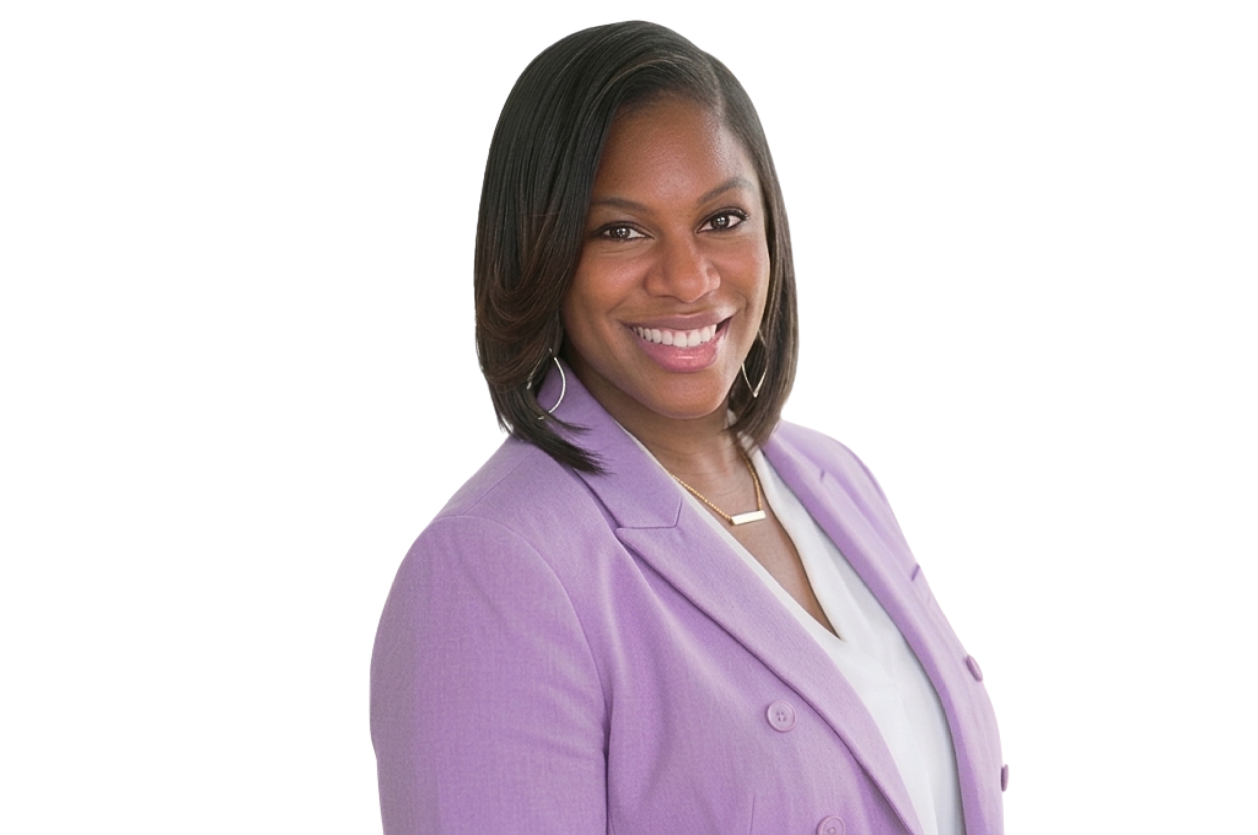 A woman dressed in a lavender blazer and white top, smiling with shoulder-length dark hair, against a plain white background.