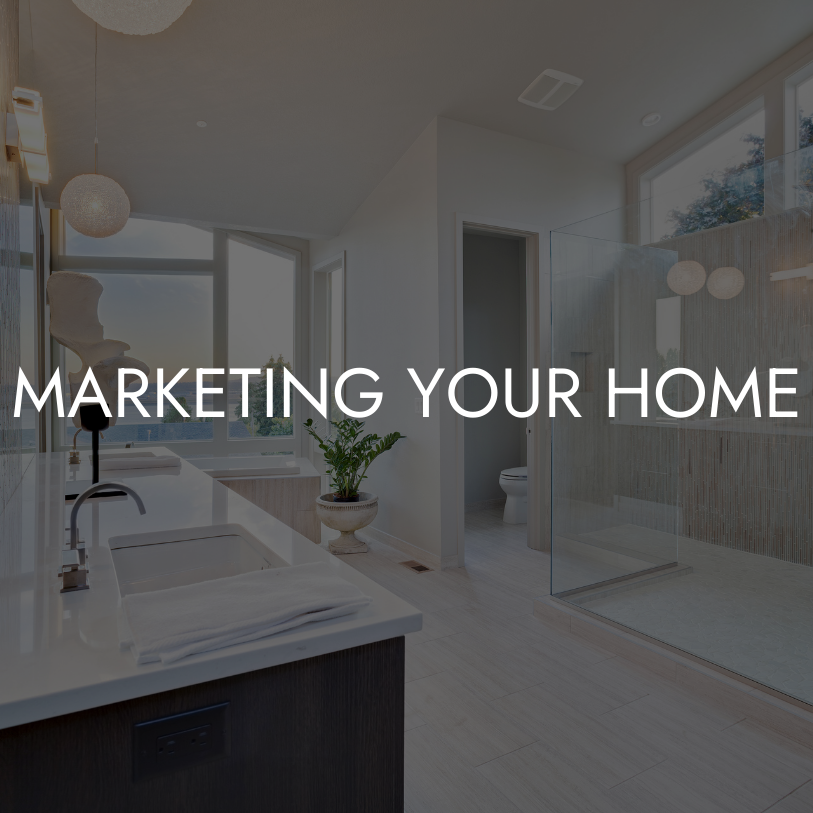 Modern bathroom with white countertops, glass shower, large windows, and indoor plant, with text overlay 'Marketing Your Home'.