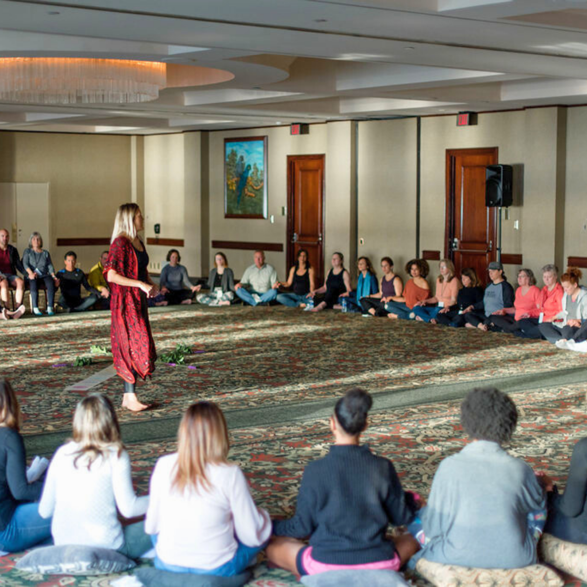 Winter Harvey facilitating a large group breathwork circle