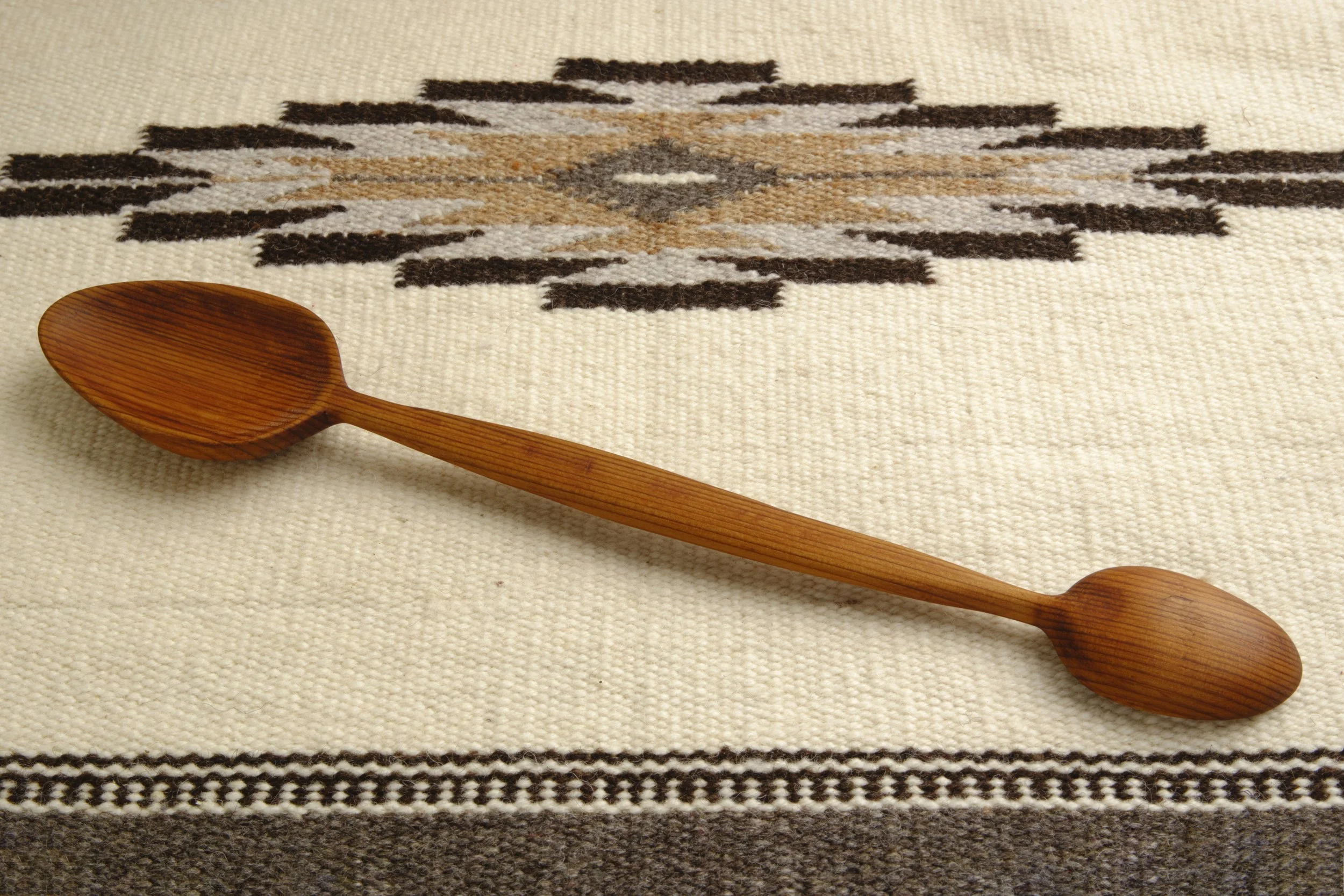 Hand-carved double-sided serving spoon