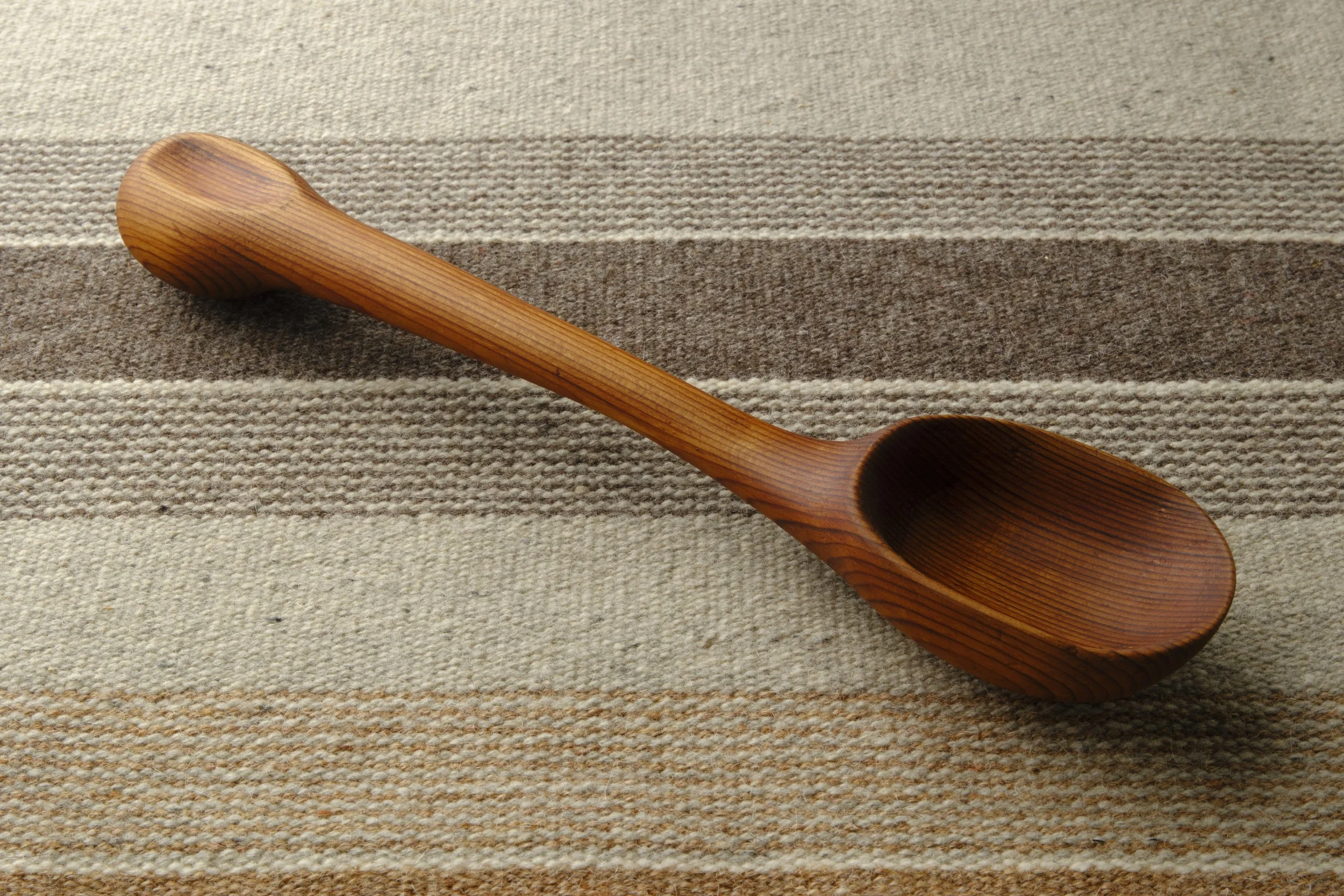 Hand-carved wooden serving spoon