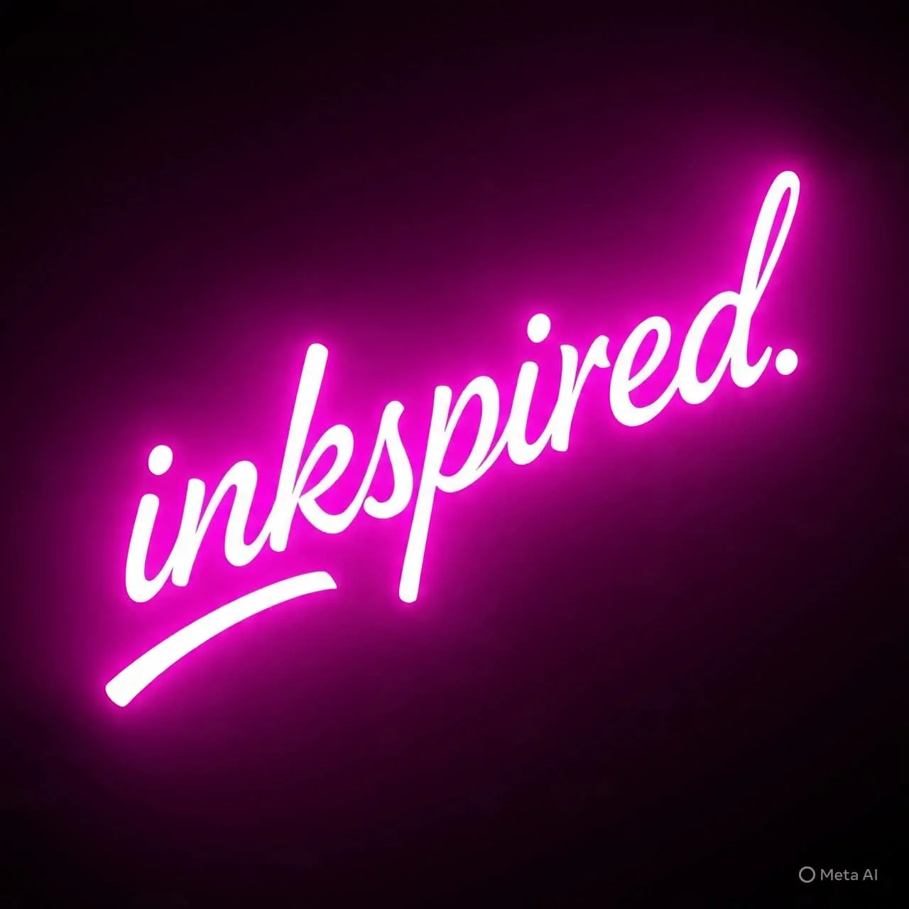 Neon pink sign that says 'inkspired.'