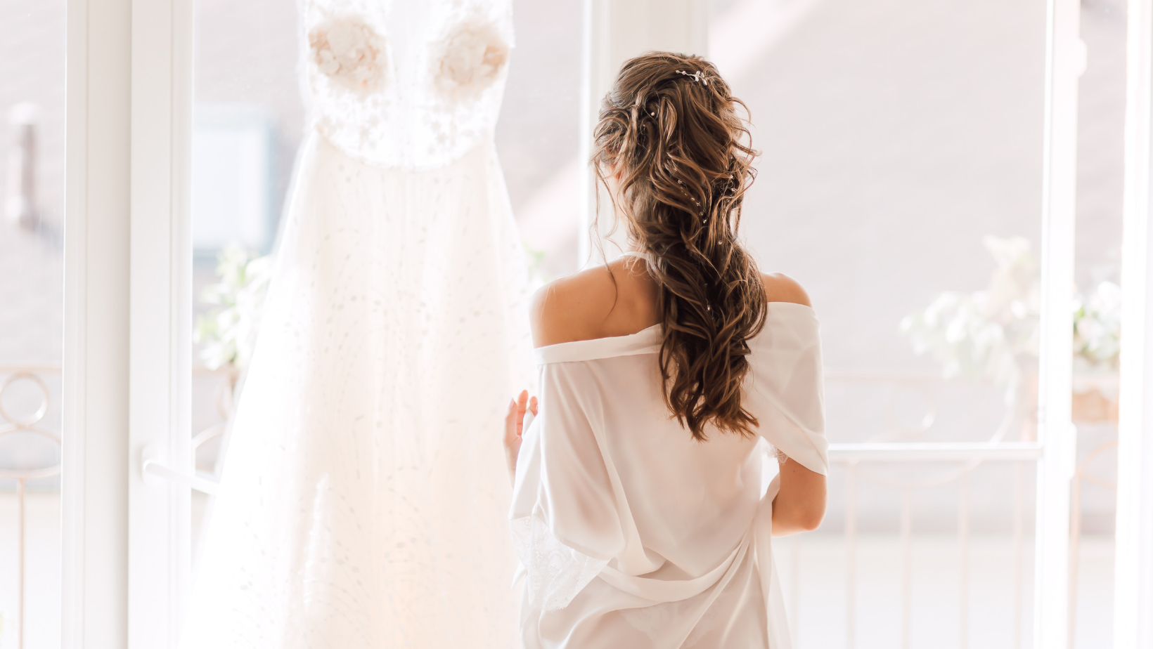 bride looking at her dress with spray tan by glow girl tanning in Goochland, Virginia