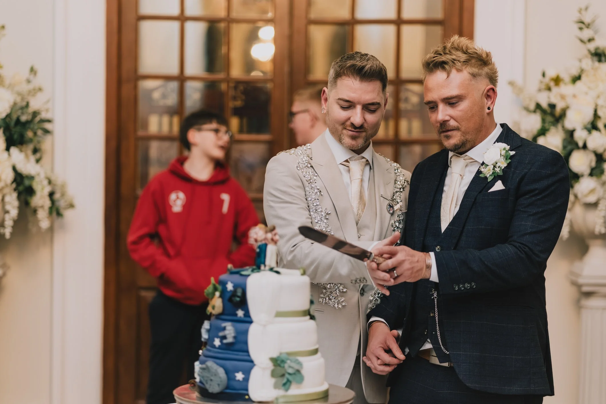 Cut the cake at Clearwell Castle captured by Gloucestershire wedding photographer
