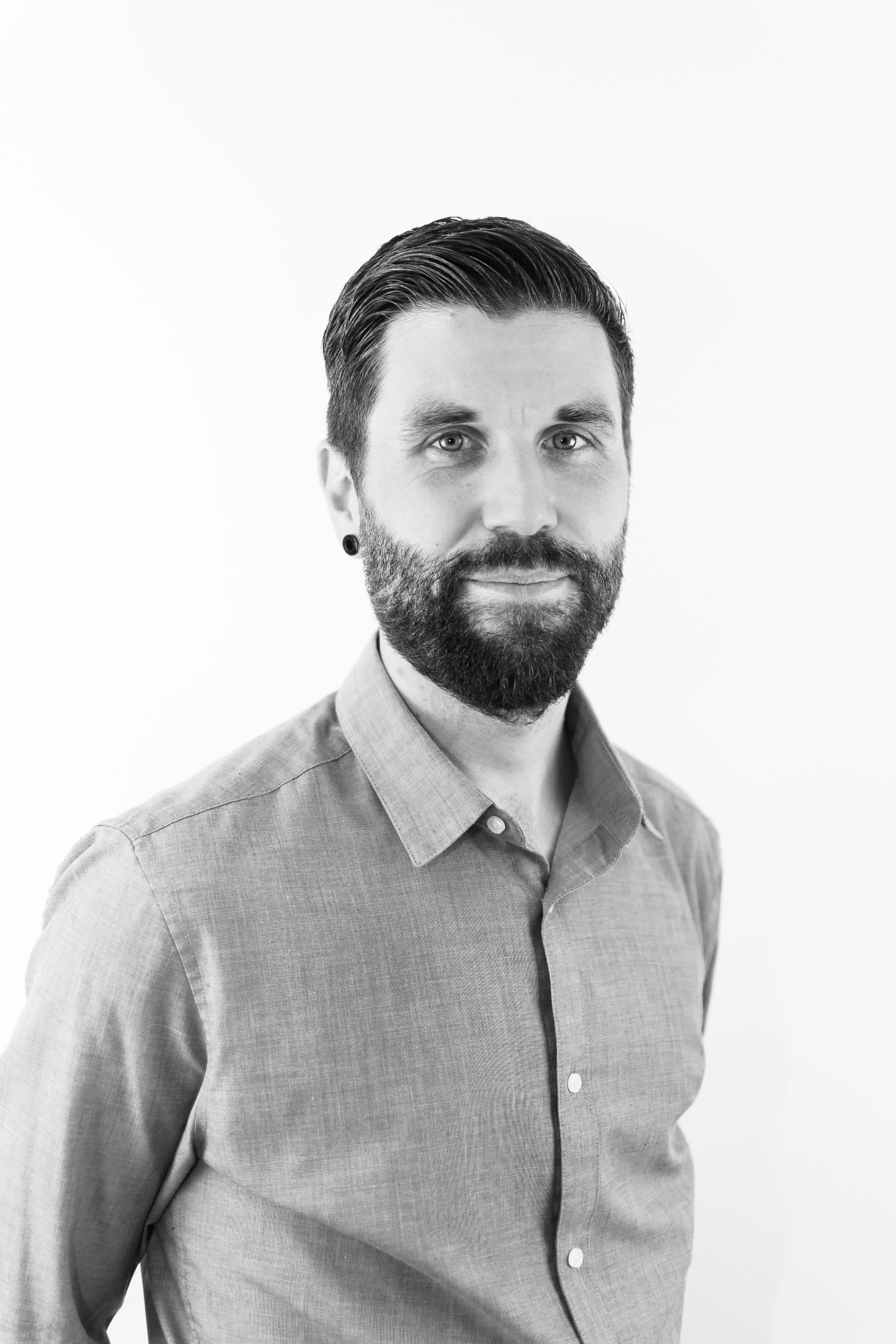 Black and white image of headshot of a office worker for LinkedIn