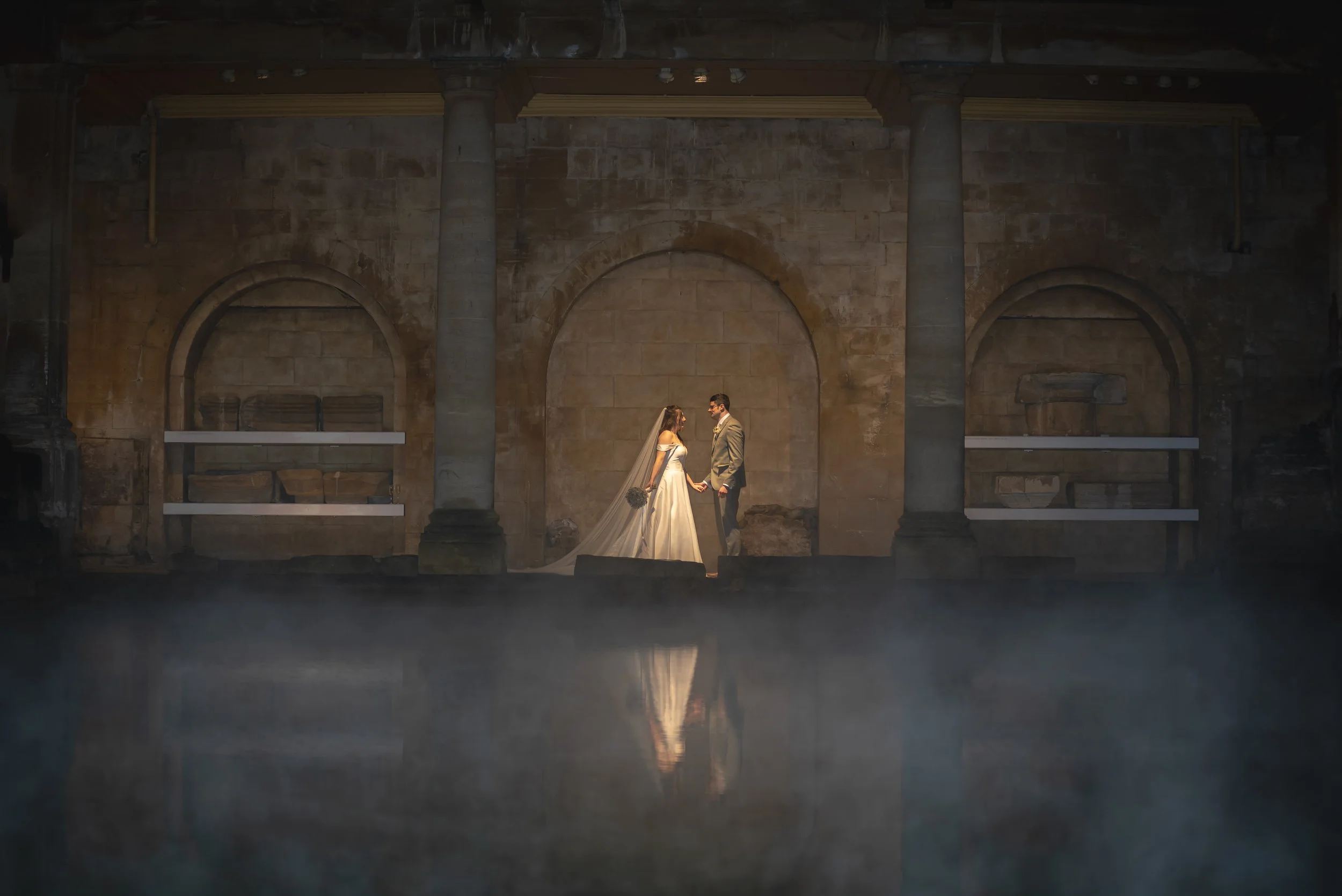 Wedding image of bride and groom shot at Roman Baths using the Sigma Art 135mm on a Sony A7iii