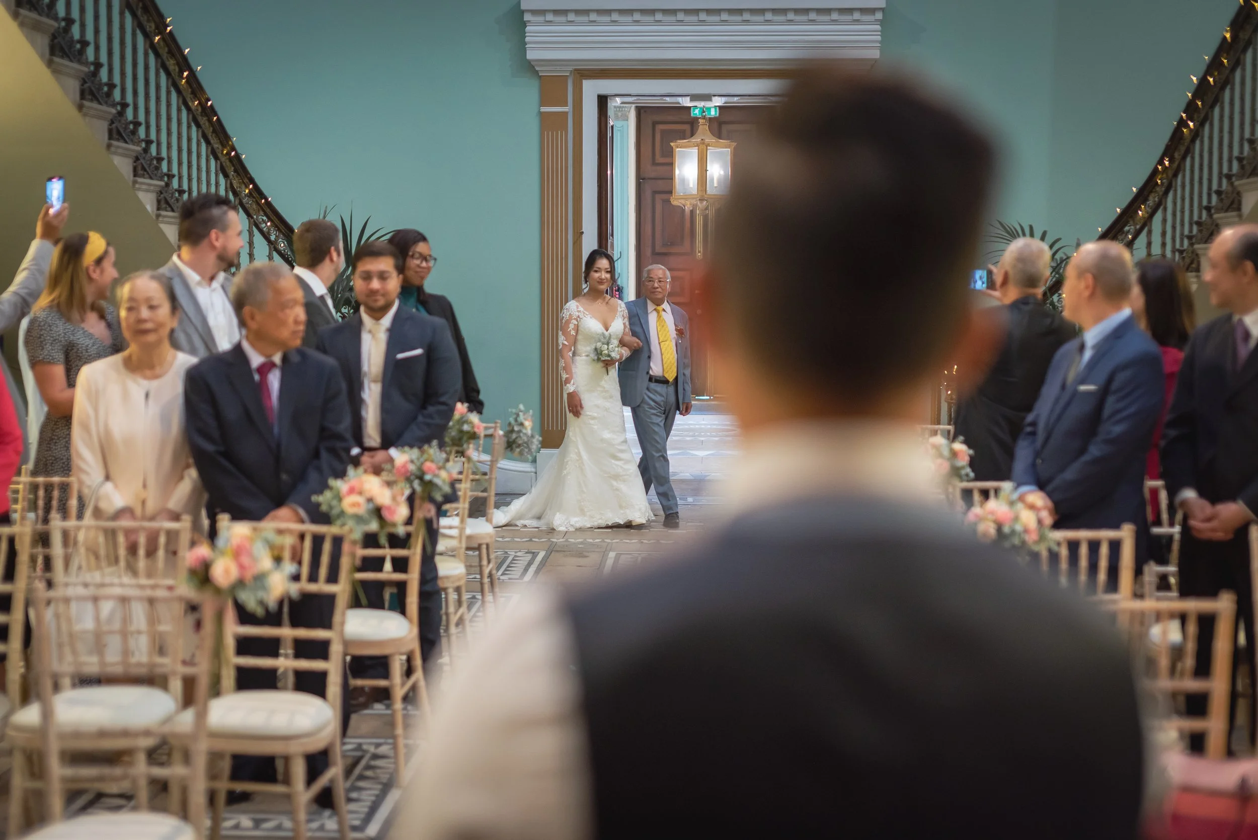 Bride walking down the aisle with Father at a Chinese Western Wedding taken place at the beautiful Leigh Court.