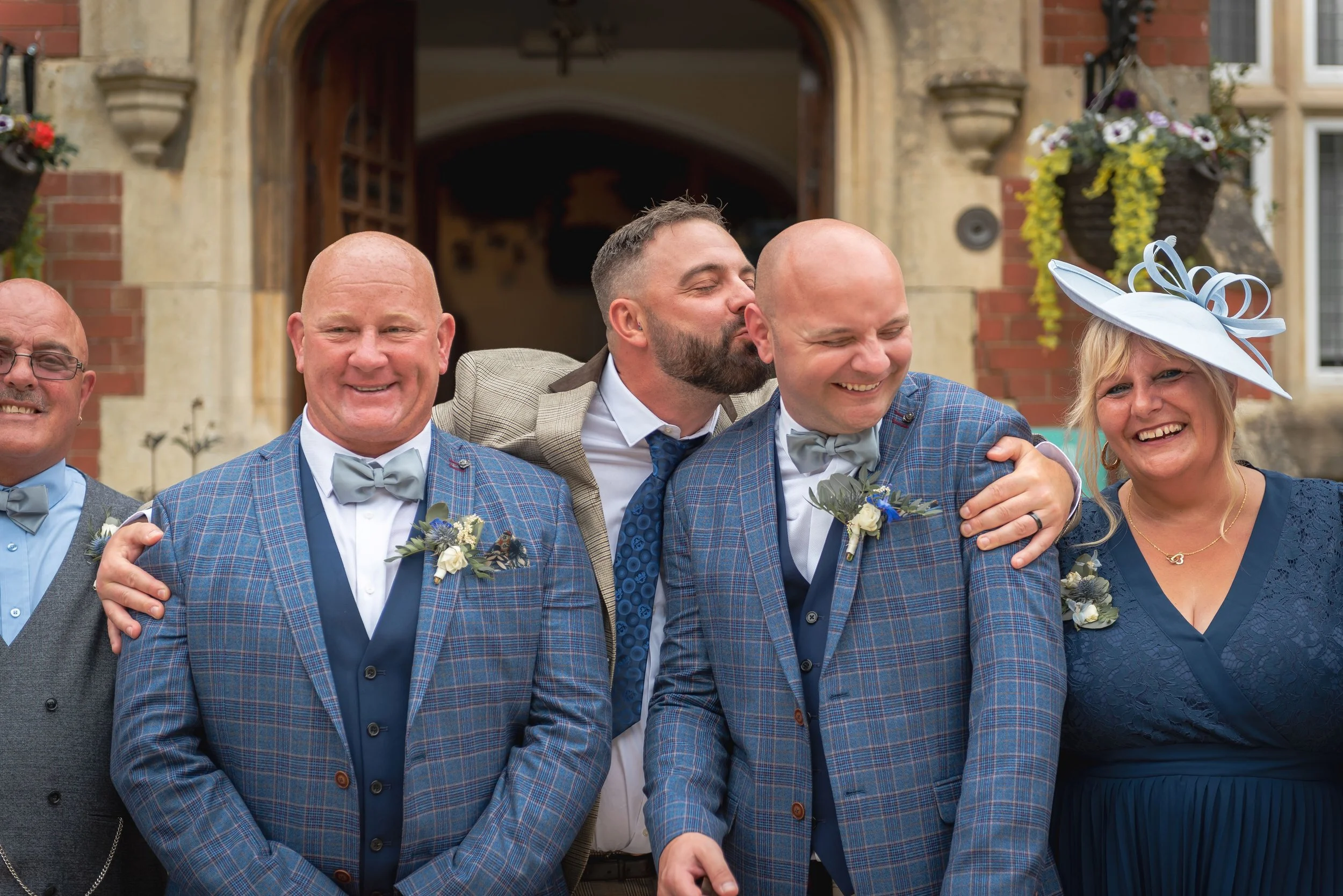 Two grooms having fun with best men at lgbt wedding in Berwick Lodge, Bristol