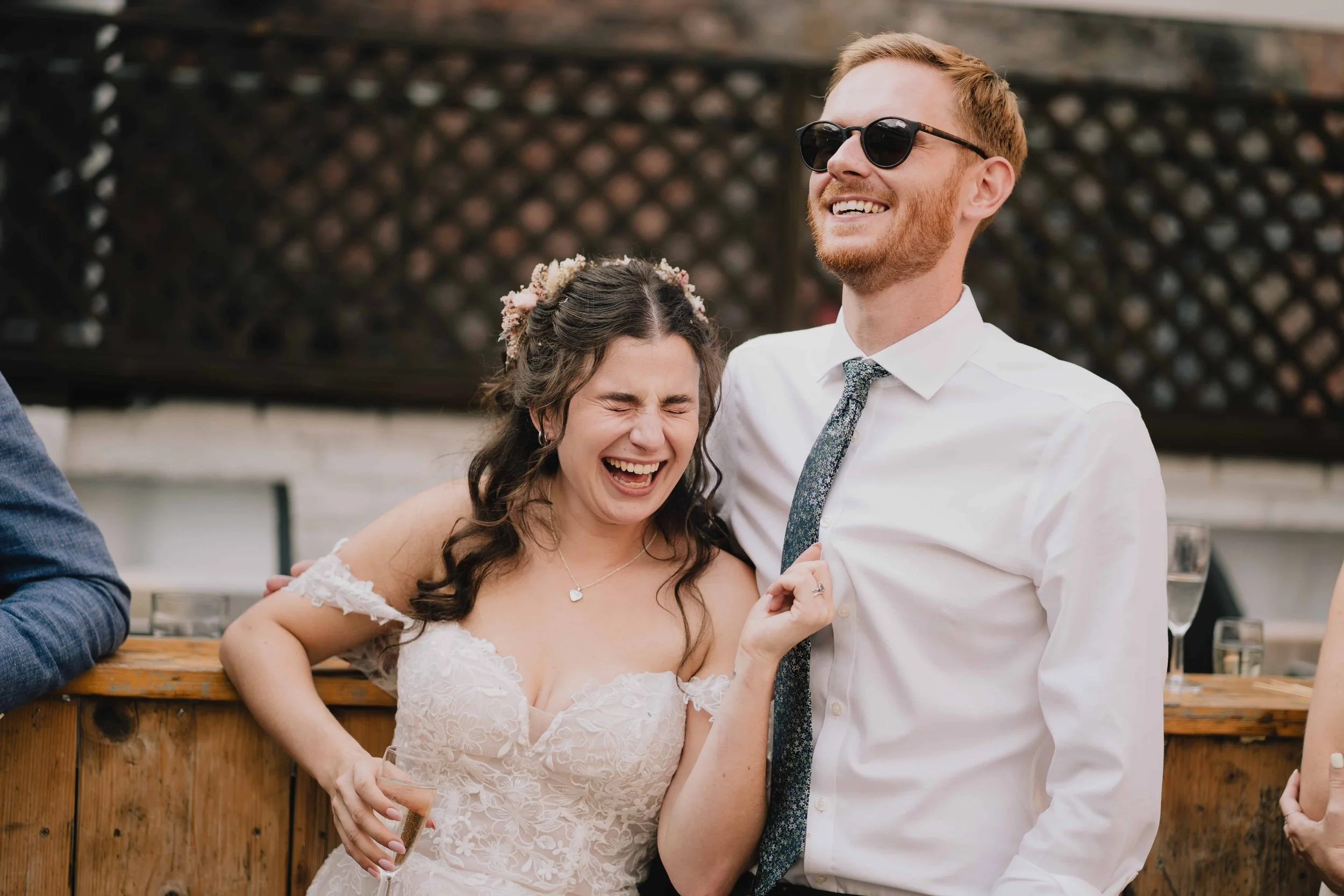 Bride and groom laughing during wedding reception at Radnor Rooms
