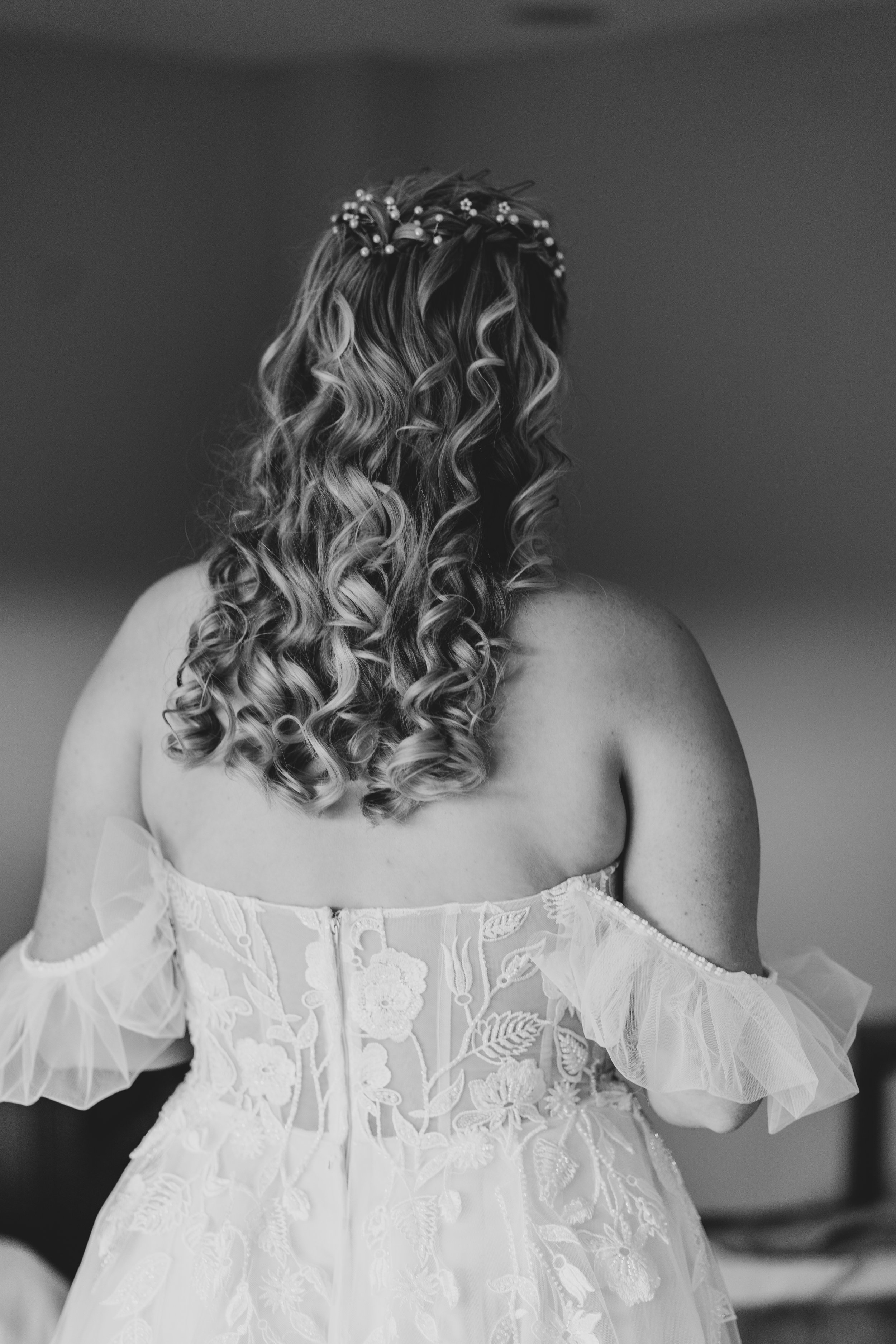 Bkac of Brides dress at wedding reception at Quantock Lakes