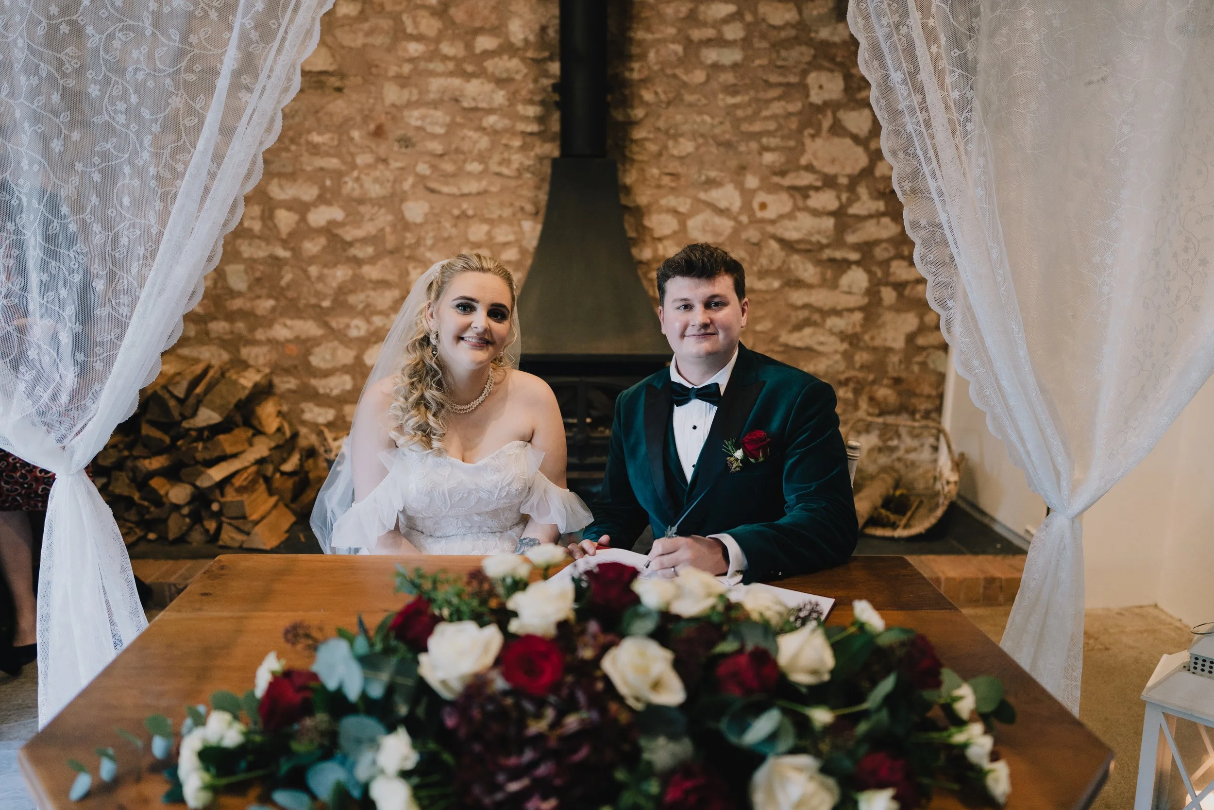 Bride and Groom smiling after signing register after theie wedding ceremony at Quantock Lakes