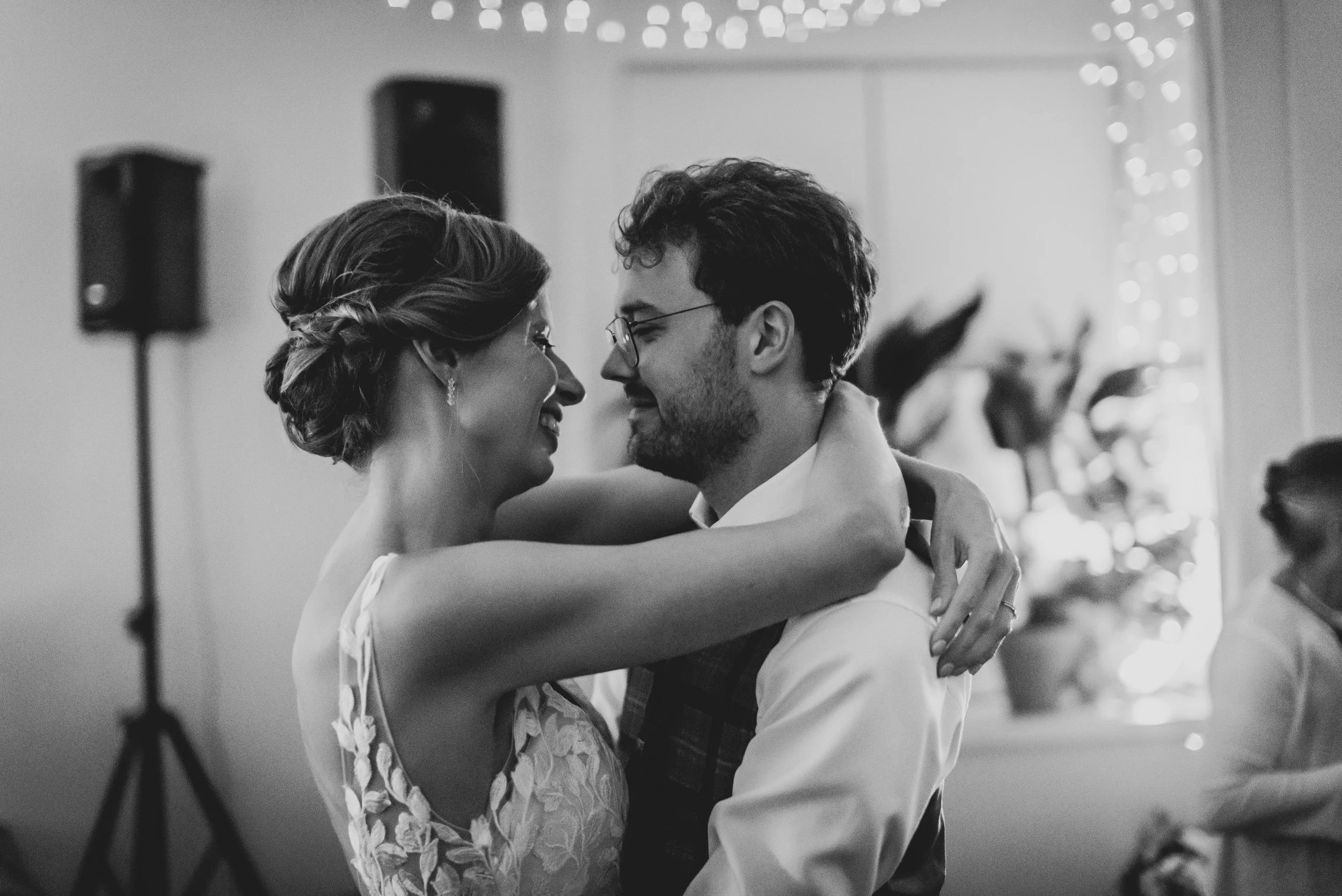 Romantic first dance of bride and groom under soft lighting at Clifton Observatory wedding in Bristol.