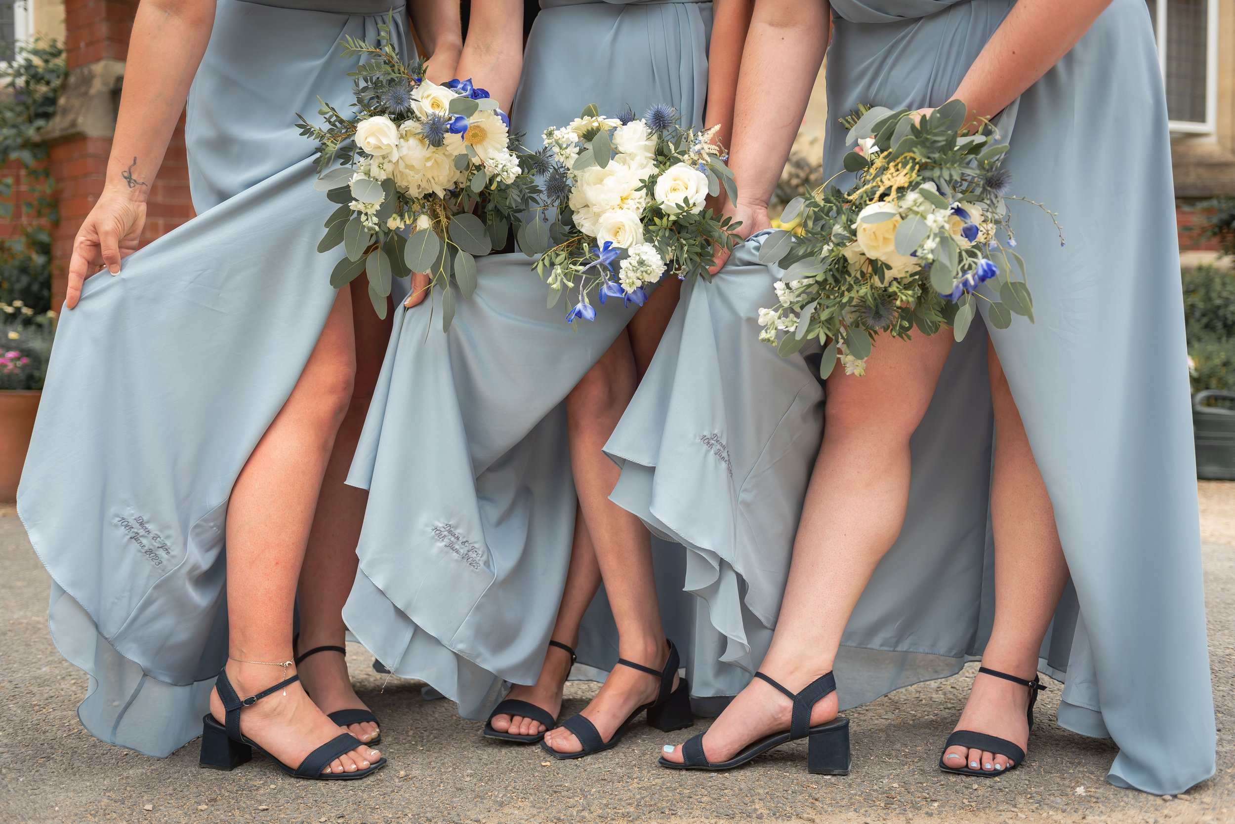 Bridesmaids showing some leg after the wedding ceremony