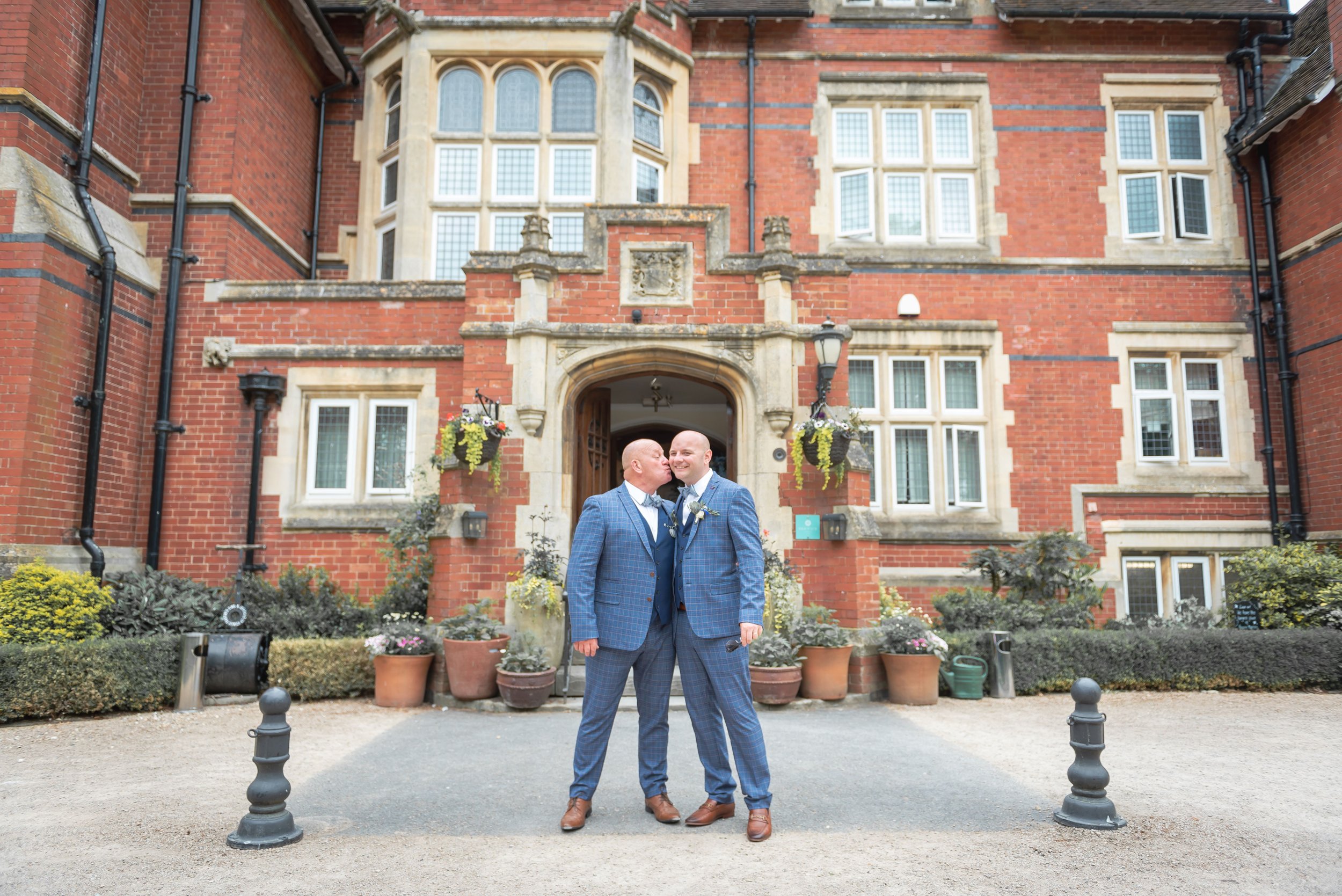 Two grooms at Berwick Lodge after just celebrating their same sex wedding