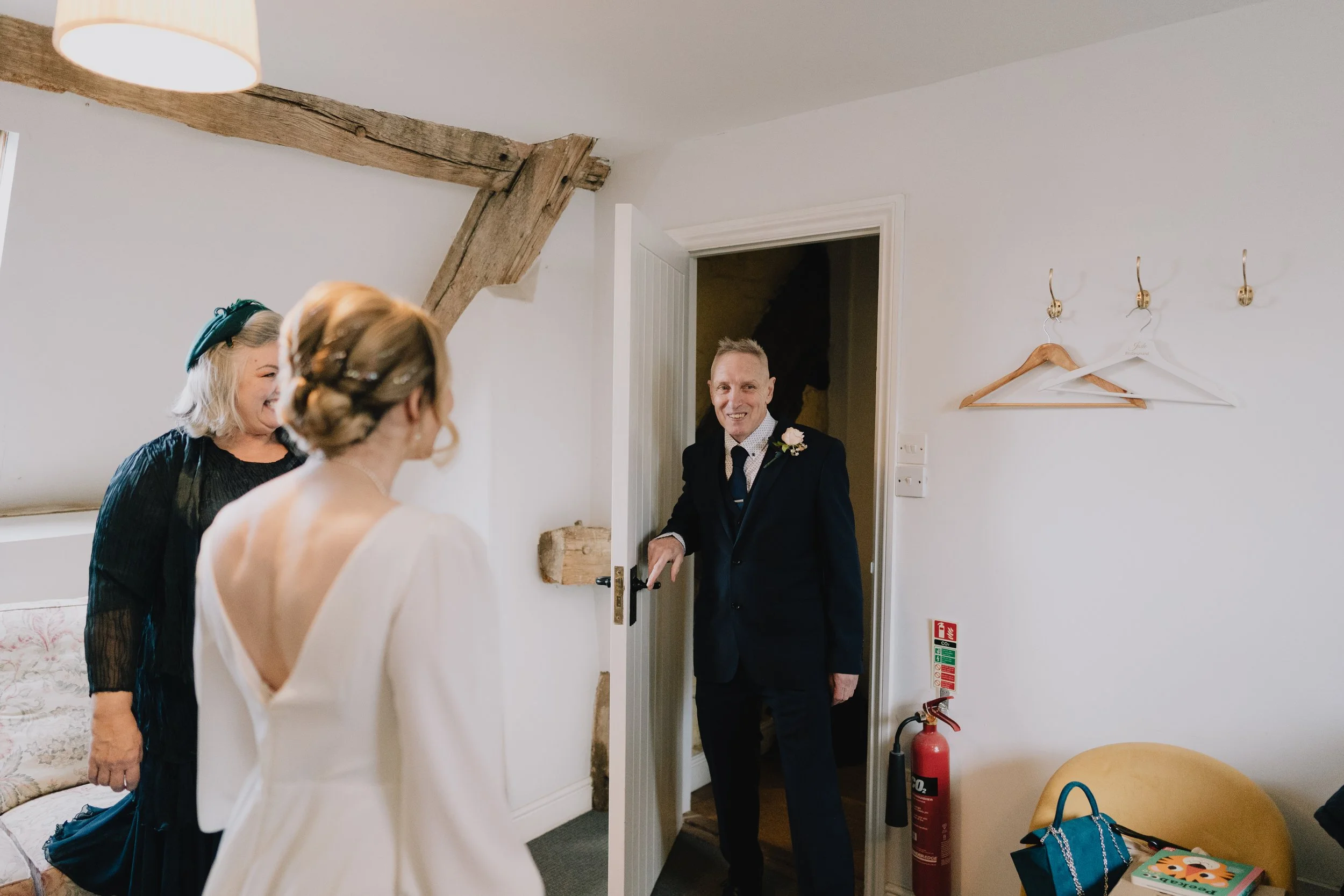 Emotional first look between father of the bride and bride on wedding morning