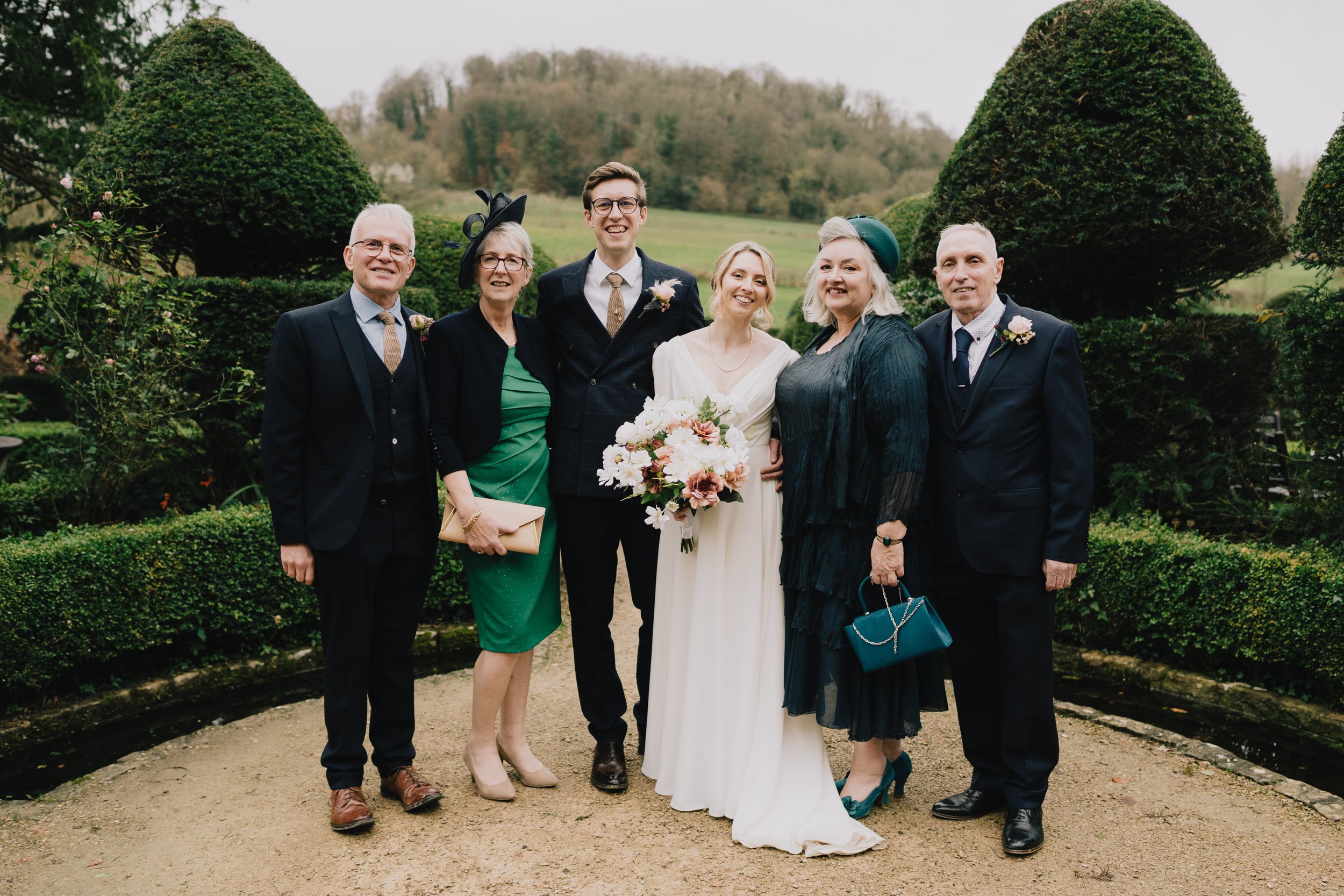 Bride and Groom family at Owlpen Manor captured by Bristol Wedding Photographer